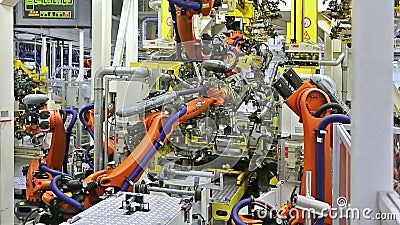 Роботы в фабрике автомобиля Роботы в фабрике автомобиля