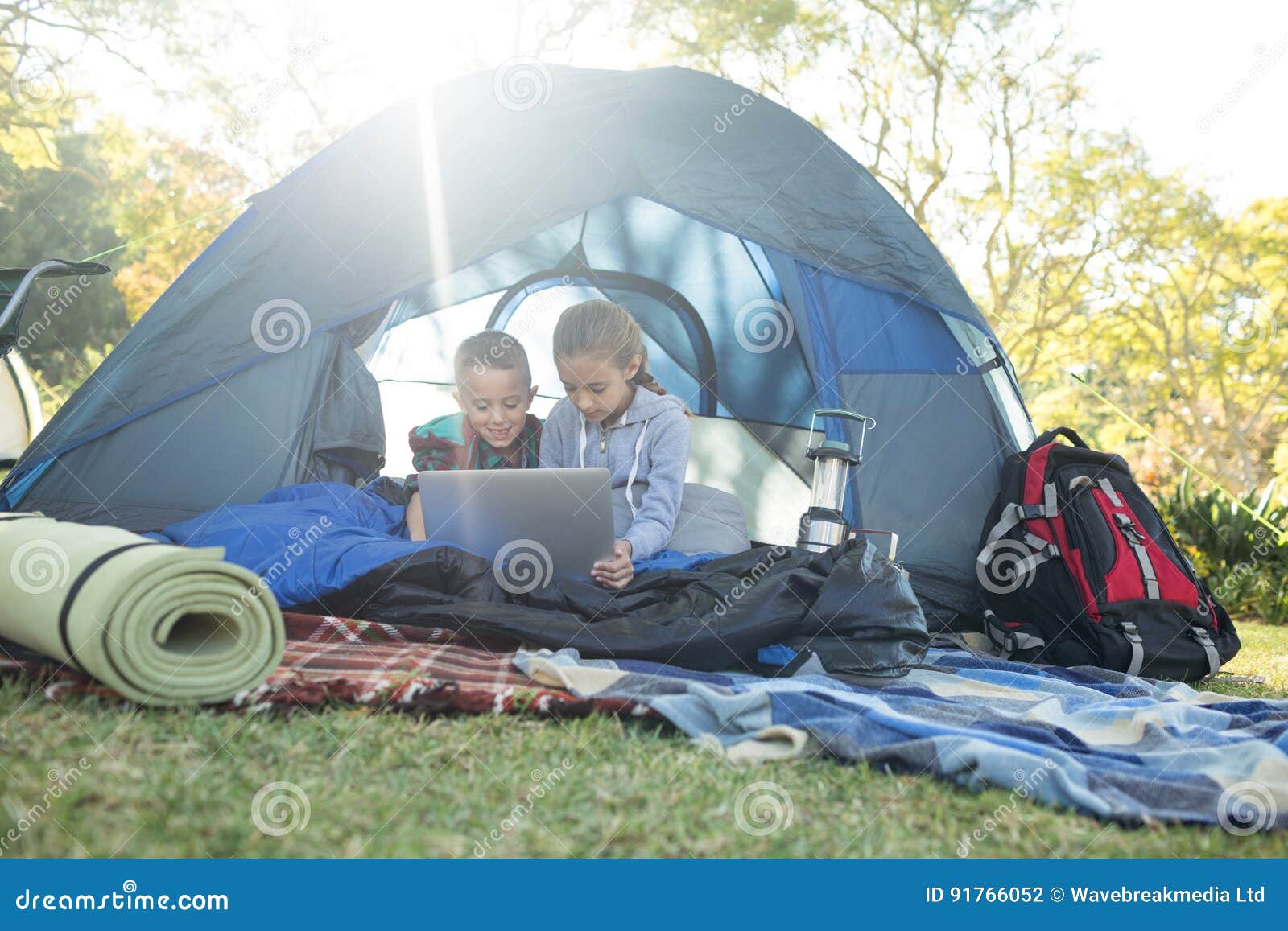 Look at the camp. Ноутбук в палатке. В палатке сестра. Книга и палатка.
