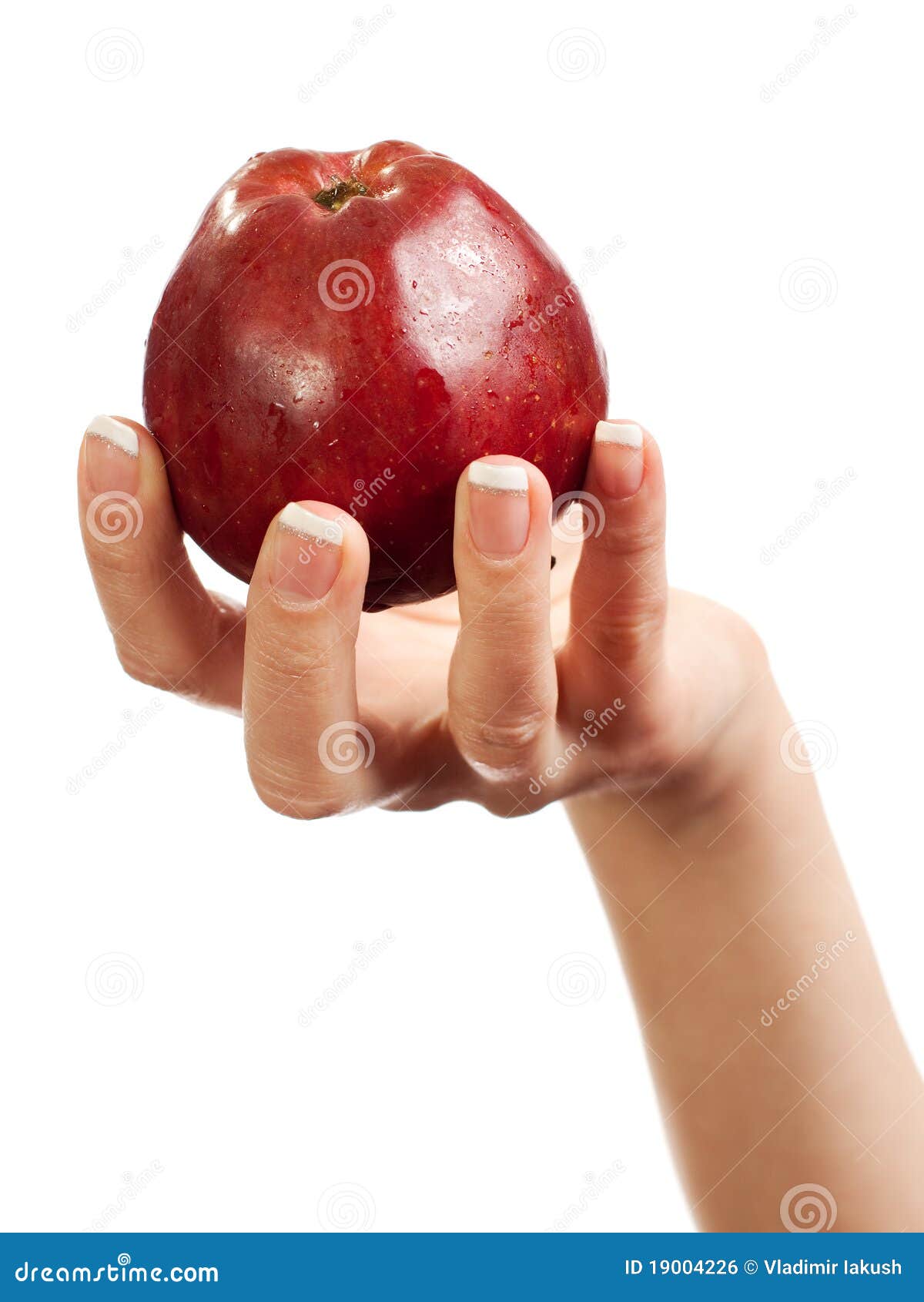 Рука держащая яблоко