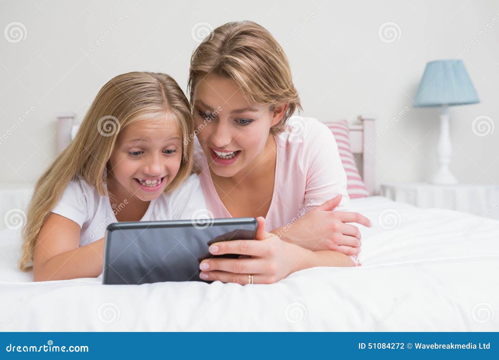 Daughter touch. Daughter Tablet. Mother daughter using Computer indian.