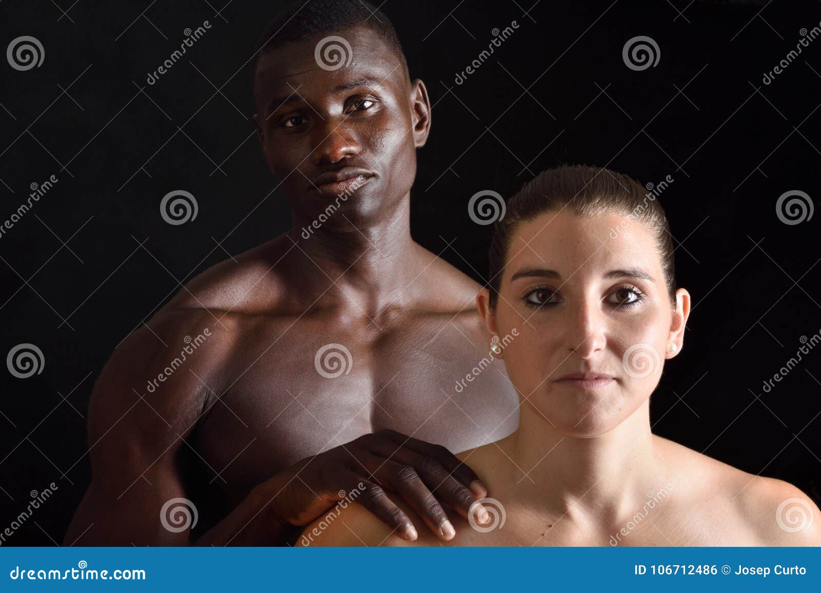Portrait of a naked couple mixed race on white stock photo