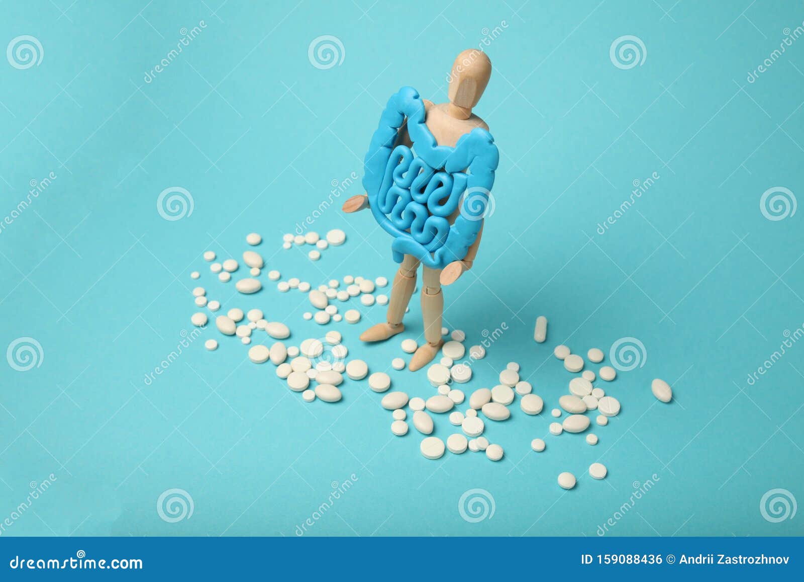 人体手中的健康肠子消化问题 肠绞痛 细菌障碍消化药 益生菌丸库存照片 图片包括有正横 药片 159088436