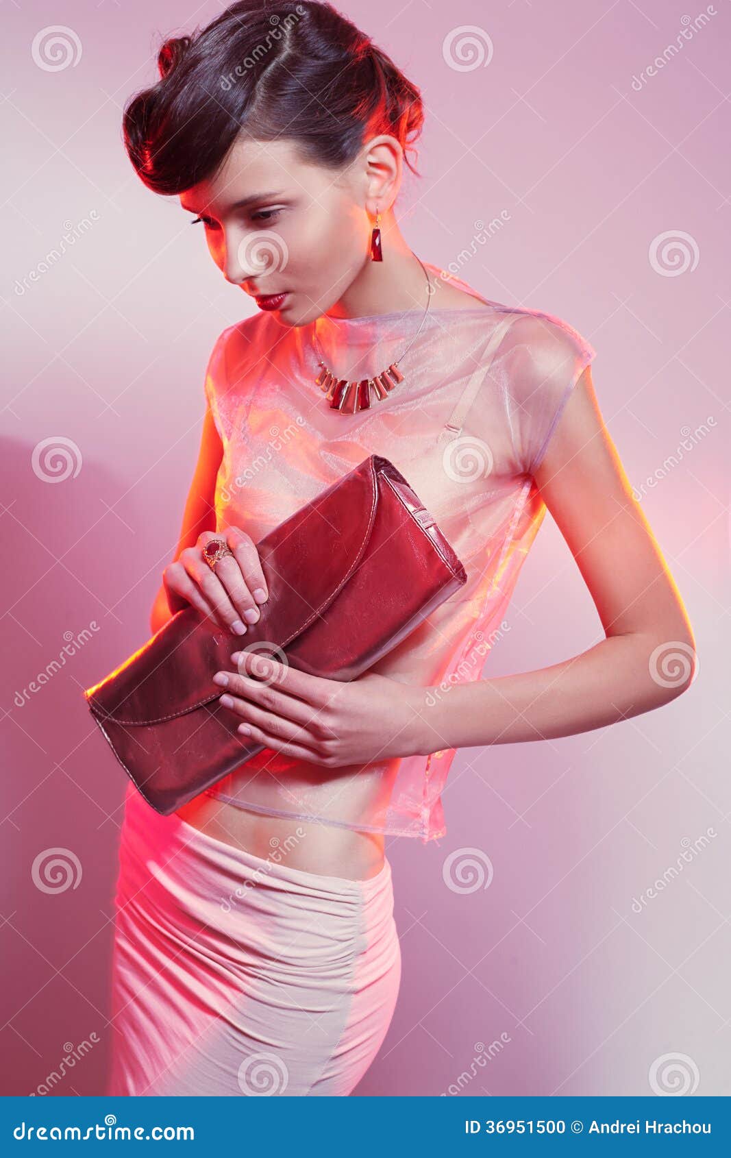 Female With Clutch Looking Down Stock Photo - Image: 36951500