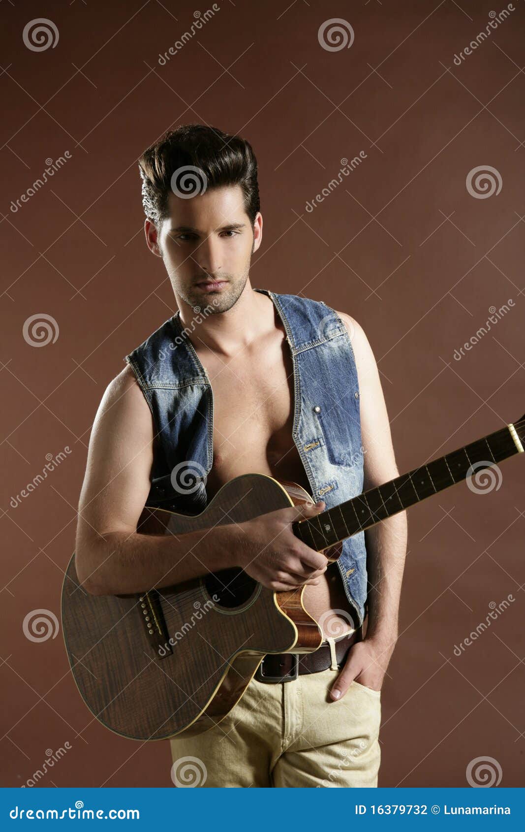 Young Man Musician Guitar Player On Brown Stock Photo 