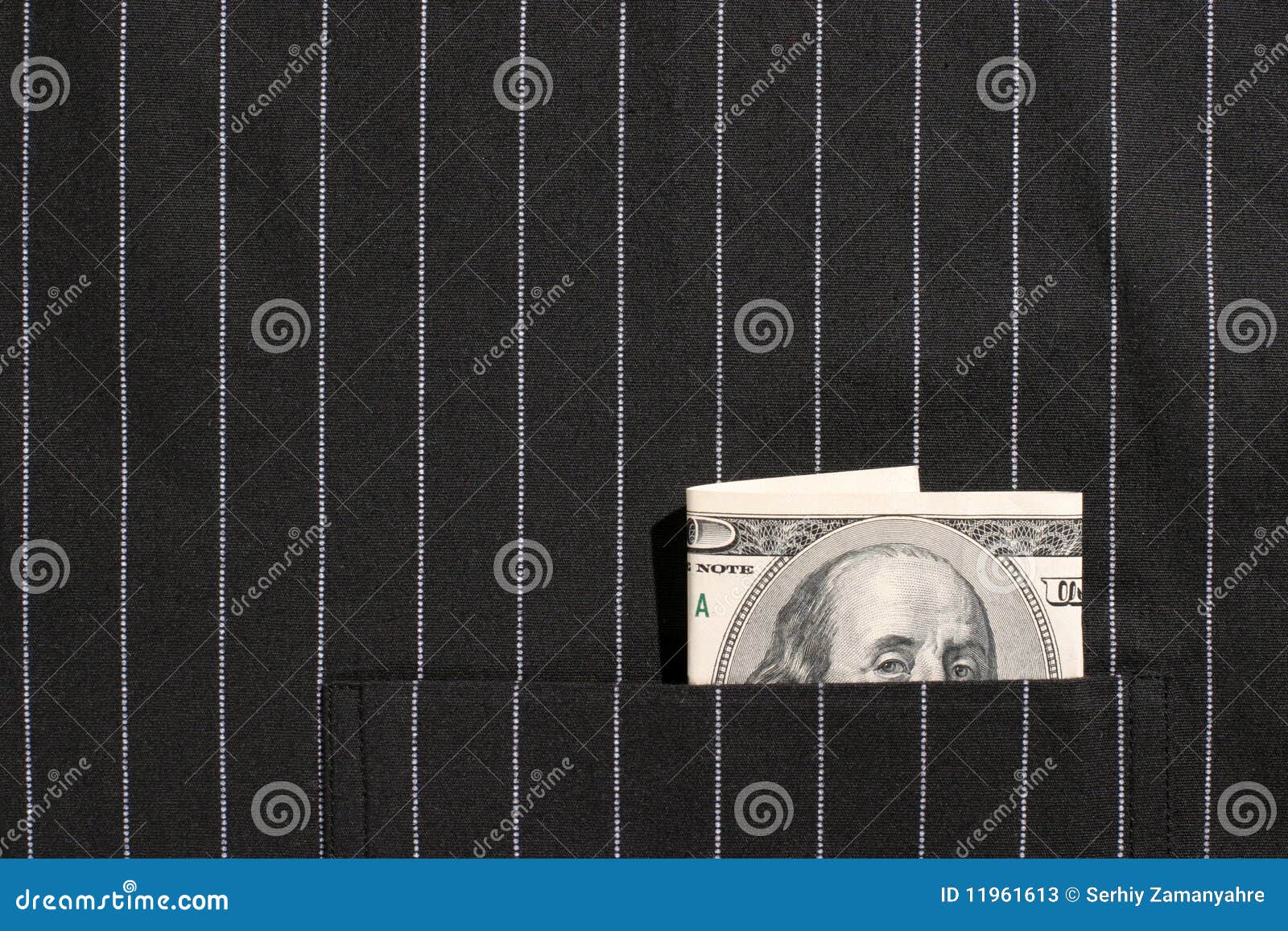 100 dollar bill in pocket of black shirt