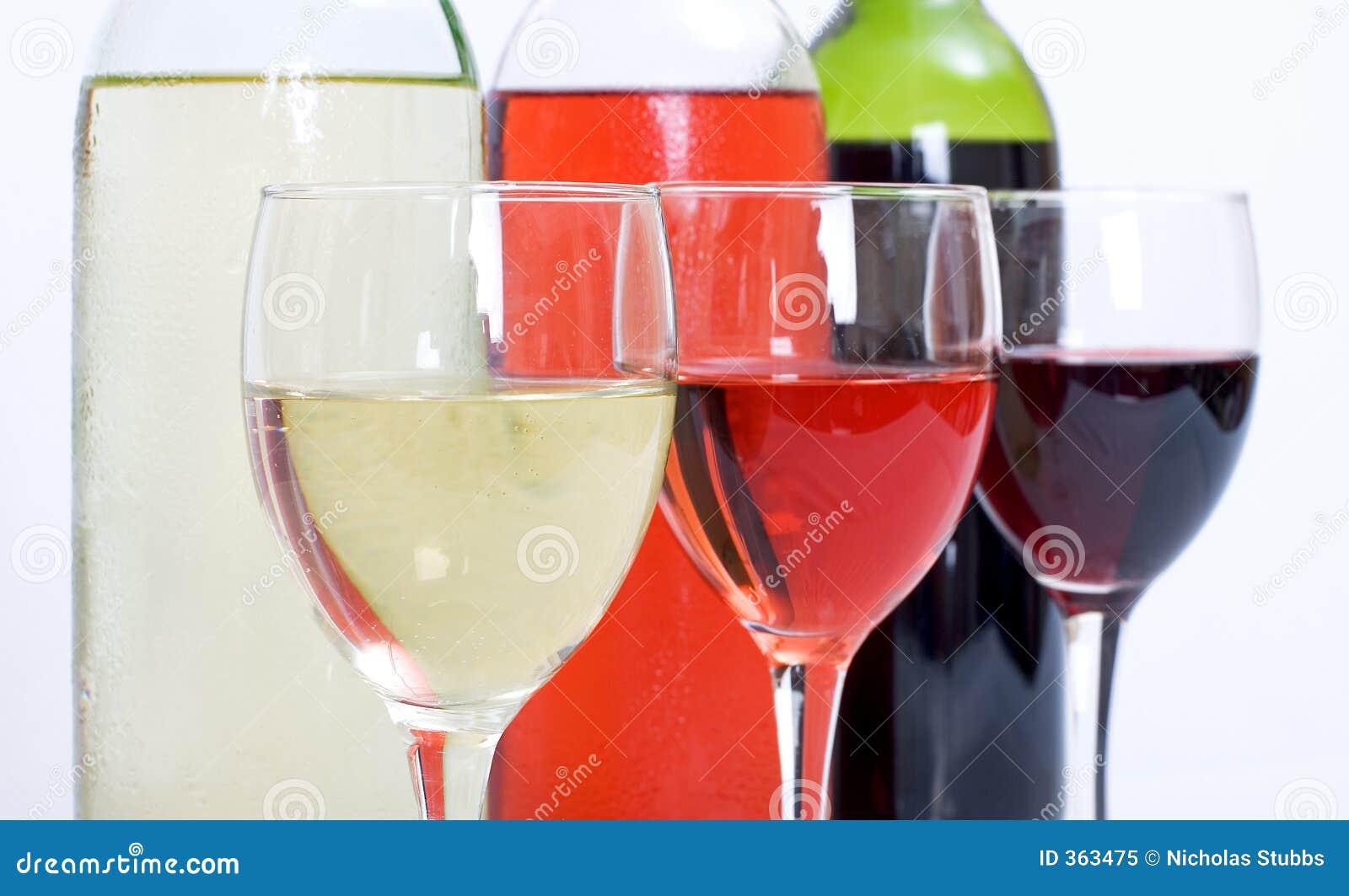 3 wine bottles and glasses
