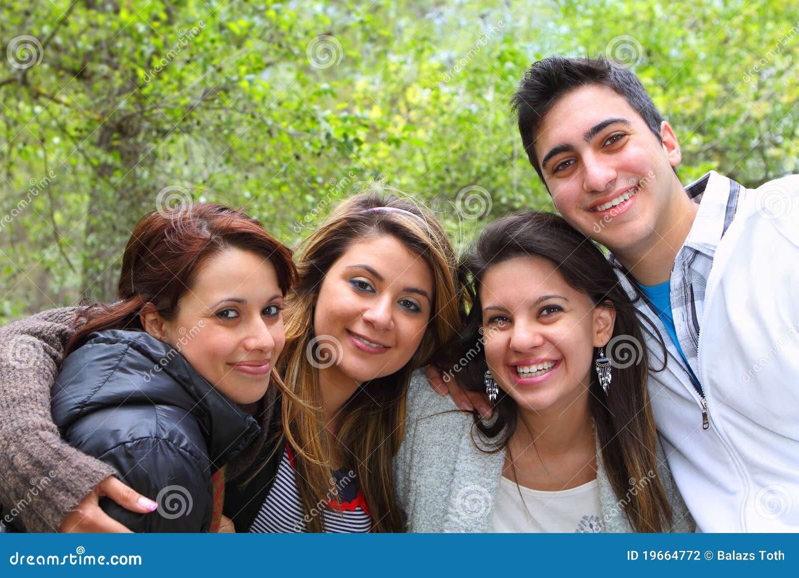 4 Friends Smiling Together stock photo. Image of brother - 19664772