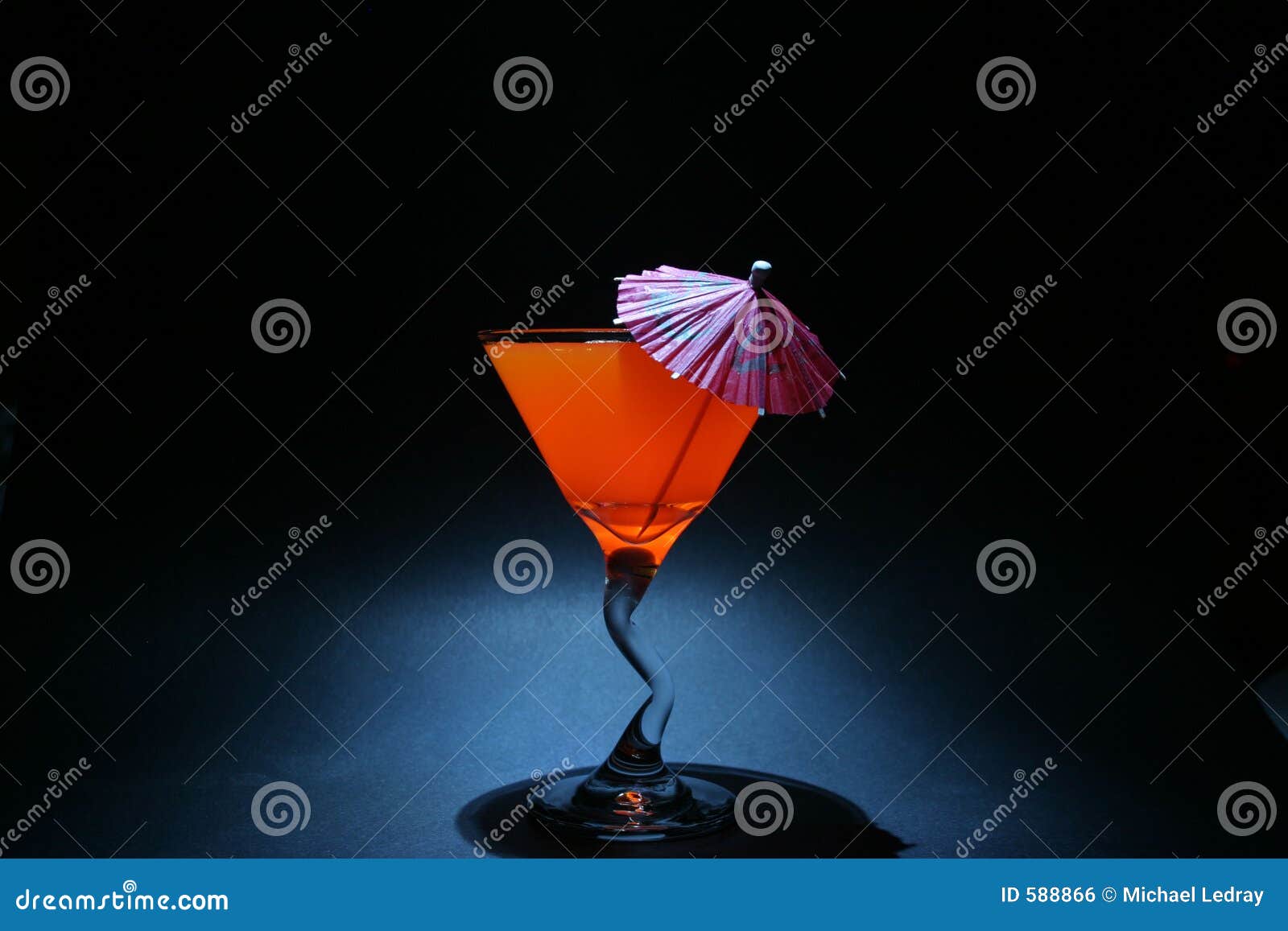 5 second time laps aka bulb exposure of orange liquid in a martini glass