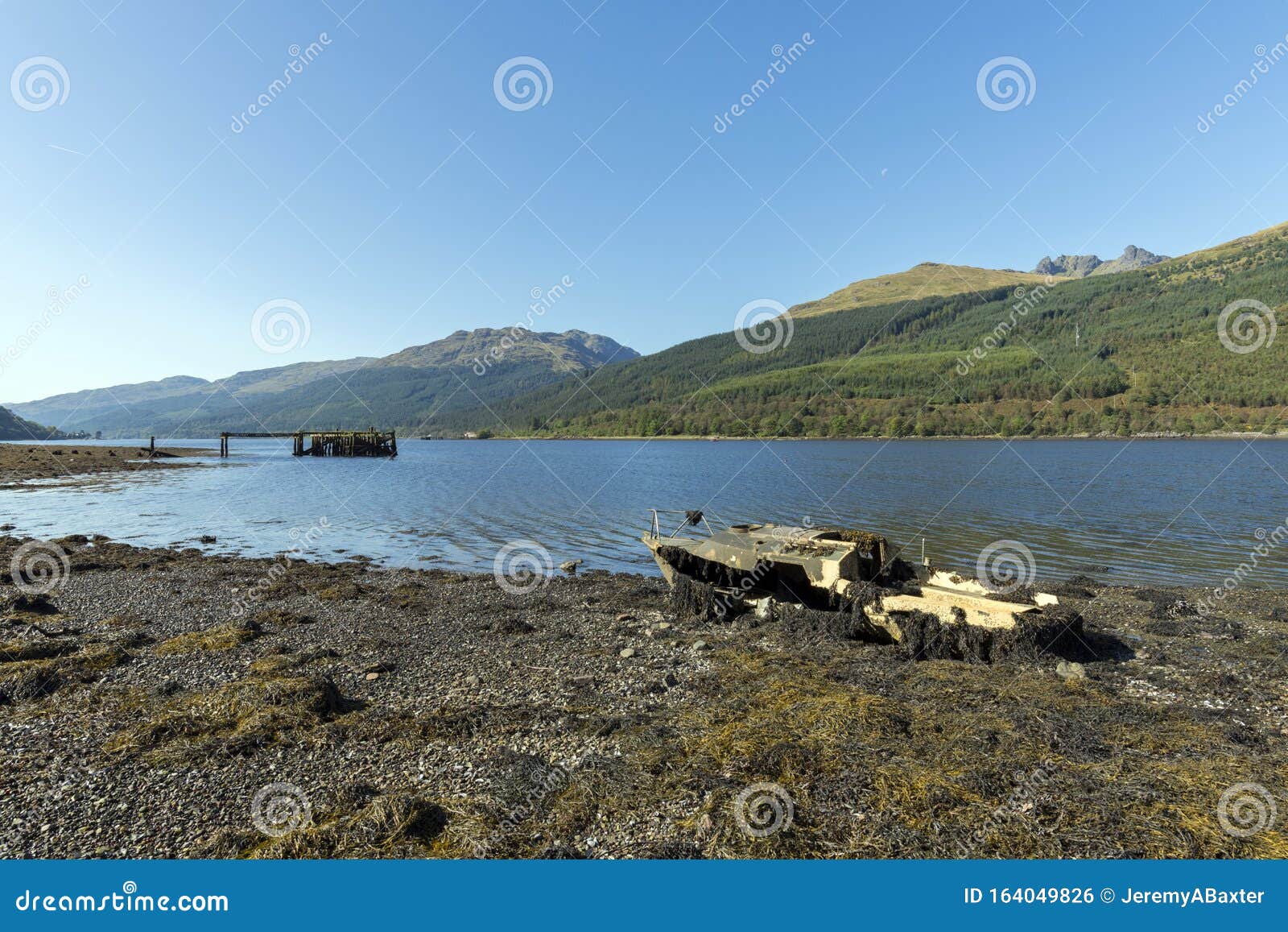 abandoned fishing boat on loch long in the trossachs national park