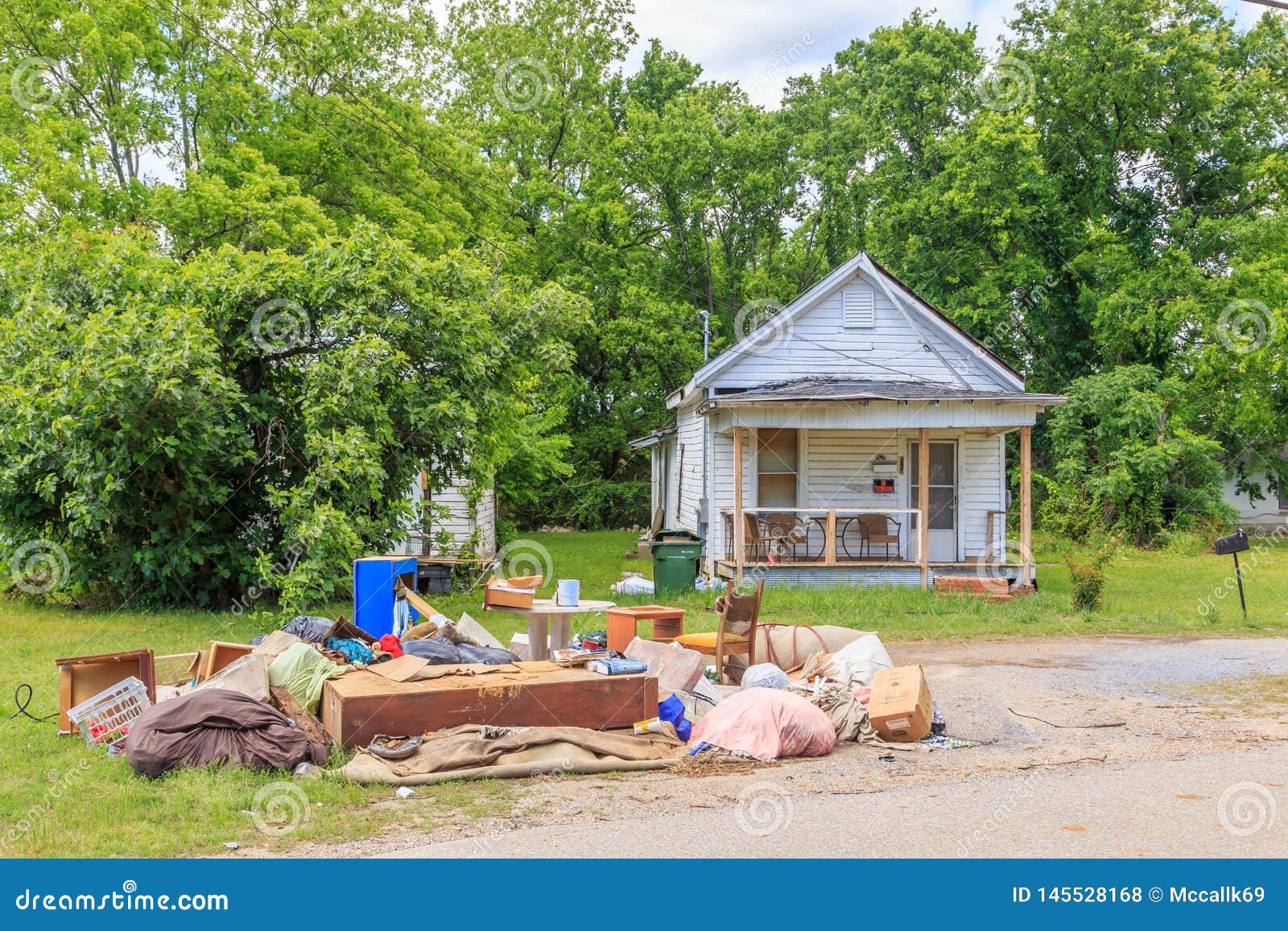 Abandoned Home With Trash On Lawn Stock Photo Image Of Embattled