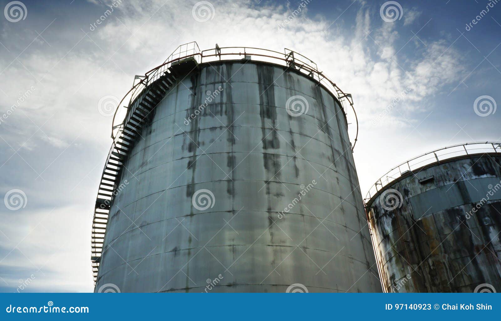 Abandoned Old Oil Tanks Against Blue Sky Stock Image Image of steel