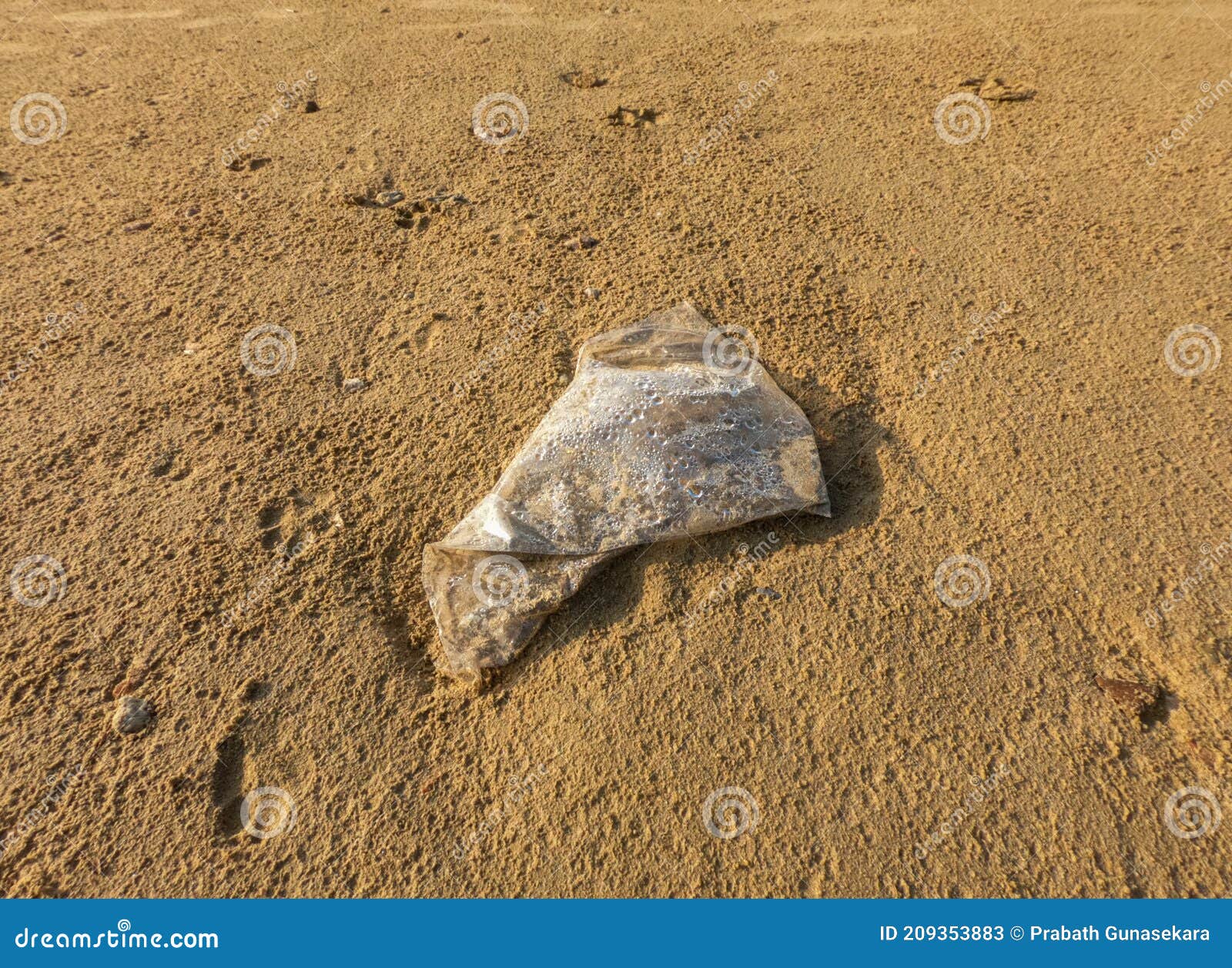 Abandoned Plastic Polythene Bag on the Beach. Stock Image Image of