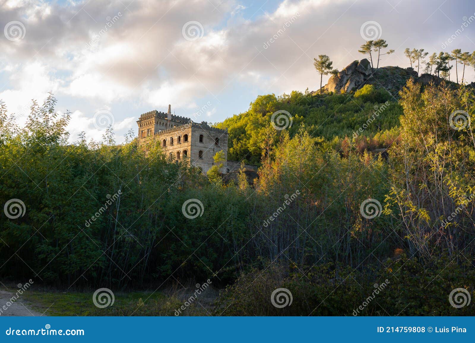 abandoned ruin building of termas radium hotel serra da pena in sortelha with beautoful colorful trees at sunset, portugal