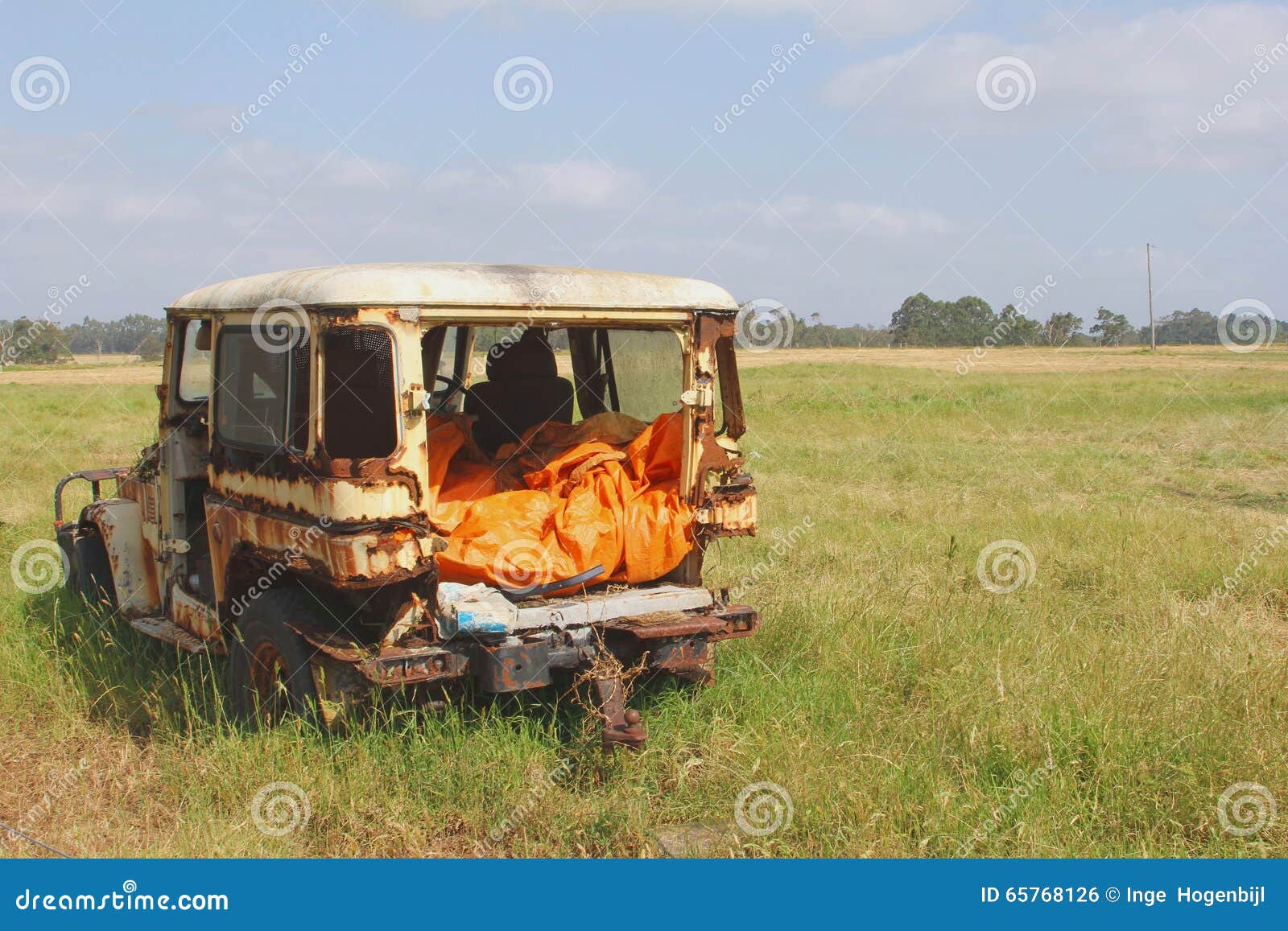 abandoned landrover car wreck decays fields, australia