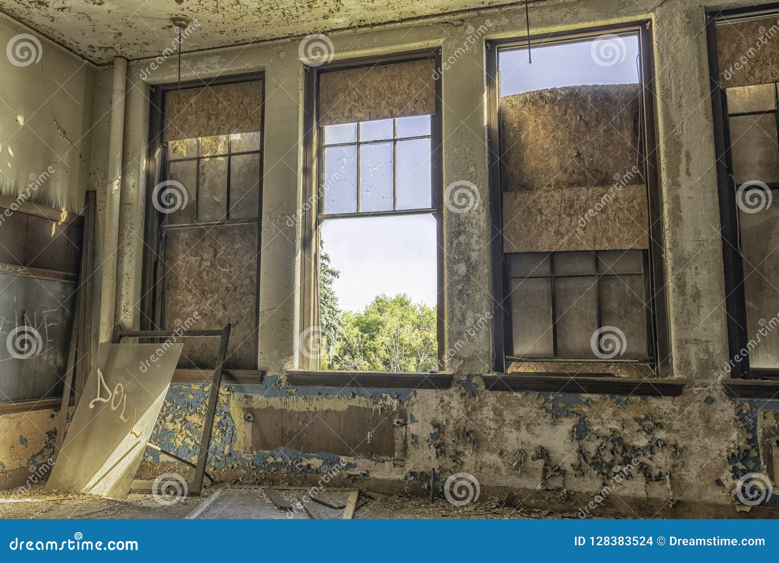 abandoned schoolroom with large windows