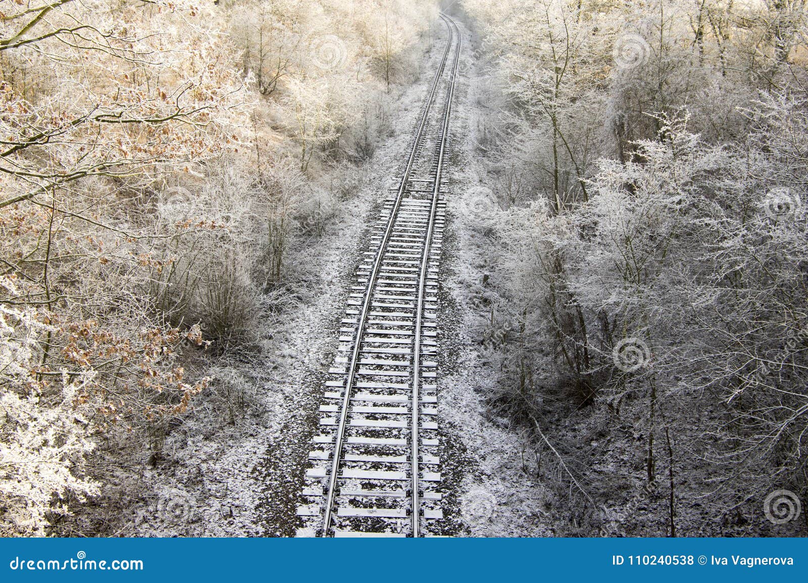 abandoned single track railway line in sunny freezing weather