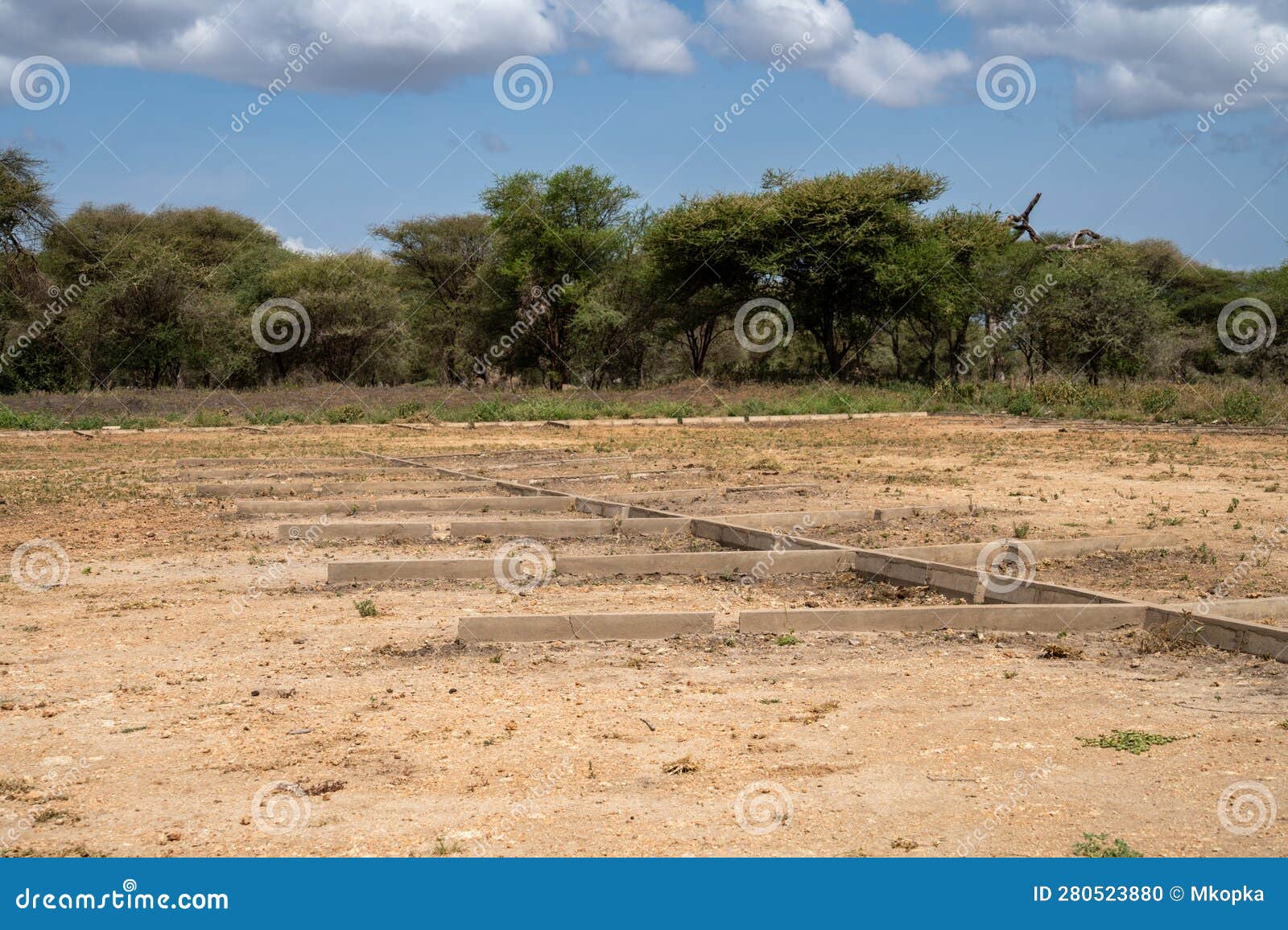 abandoned and unkept parking lot for safari vehicles in tarangire national park in tanzania