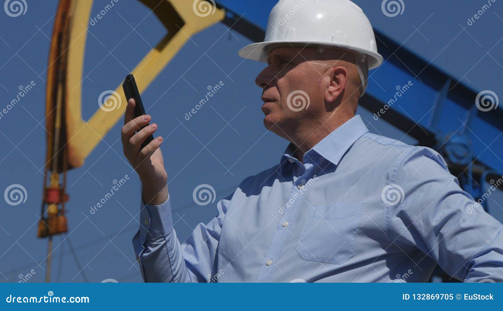 Petroleum Engineer Working in Extracting Oil Industry Using Mobile Phone Stock Image Image of