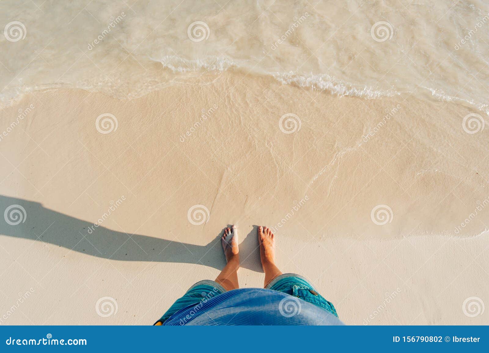 view of sandy beach with waves and clear ocean water