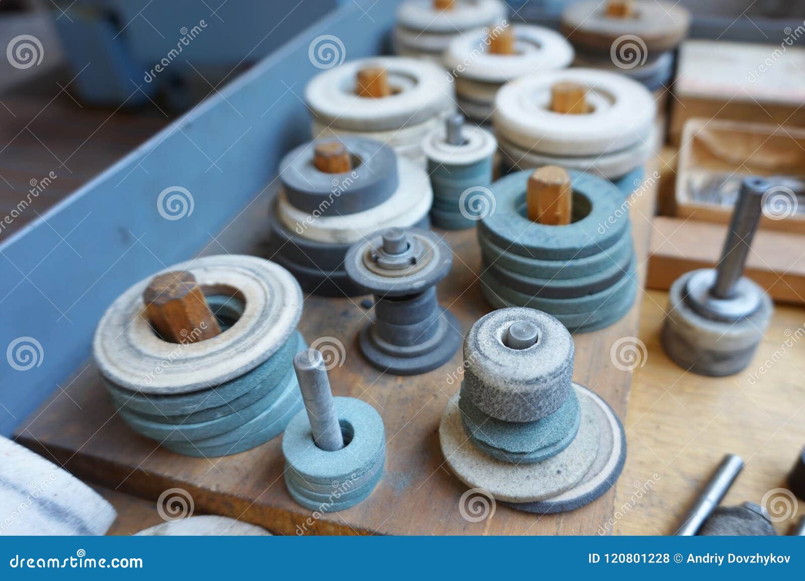 Abrasive Grinding Wheels on the Rack are Ready To Work. Stock Photo