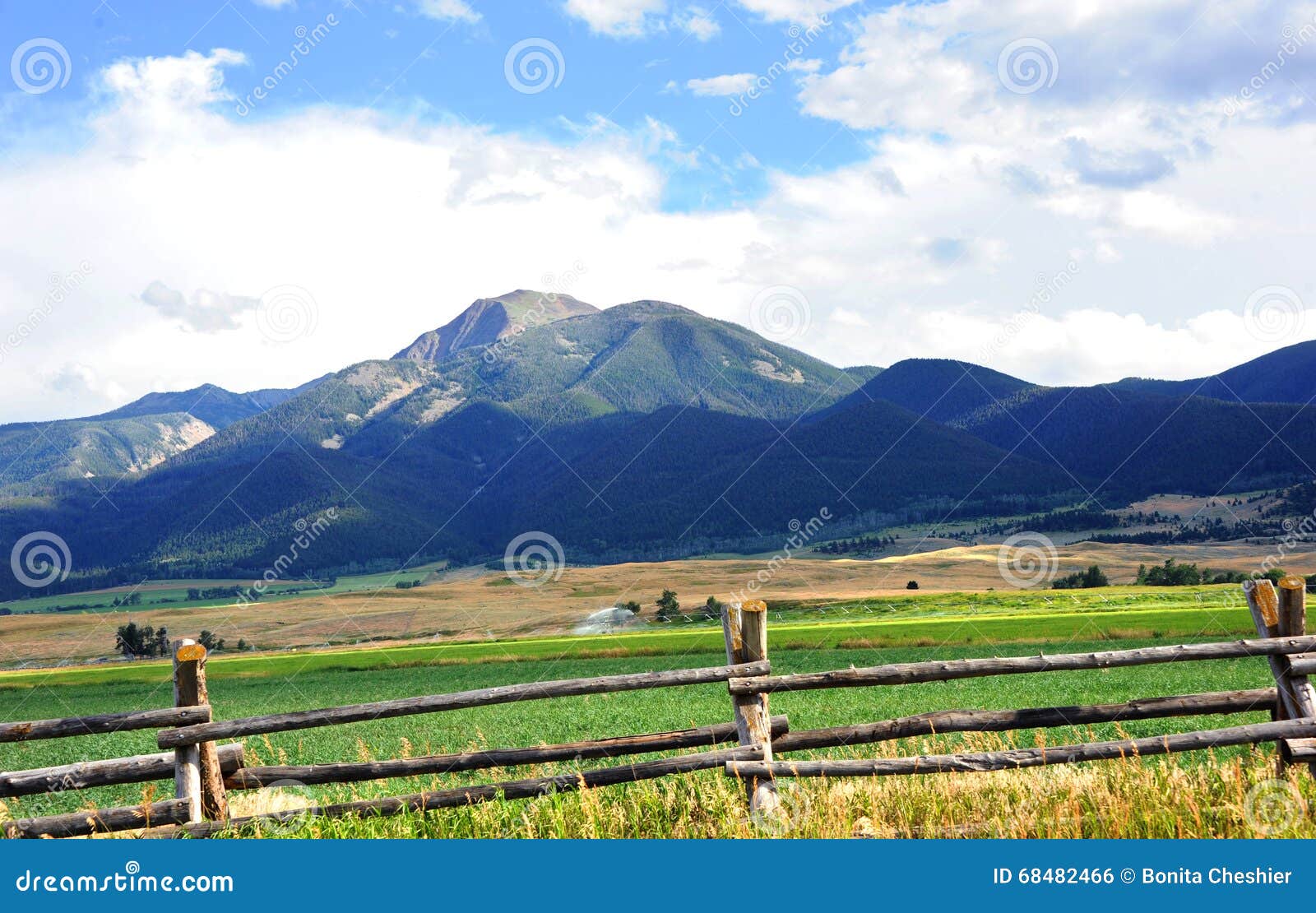 absaroka mountains loom over farm