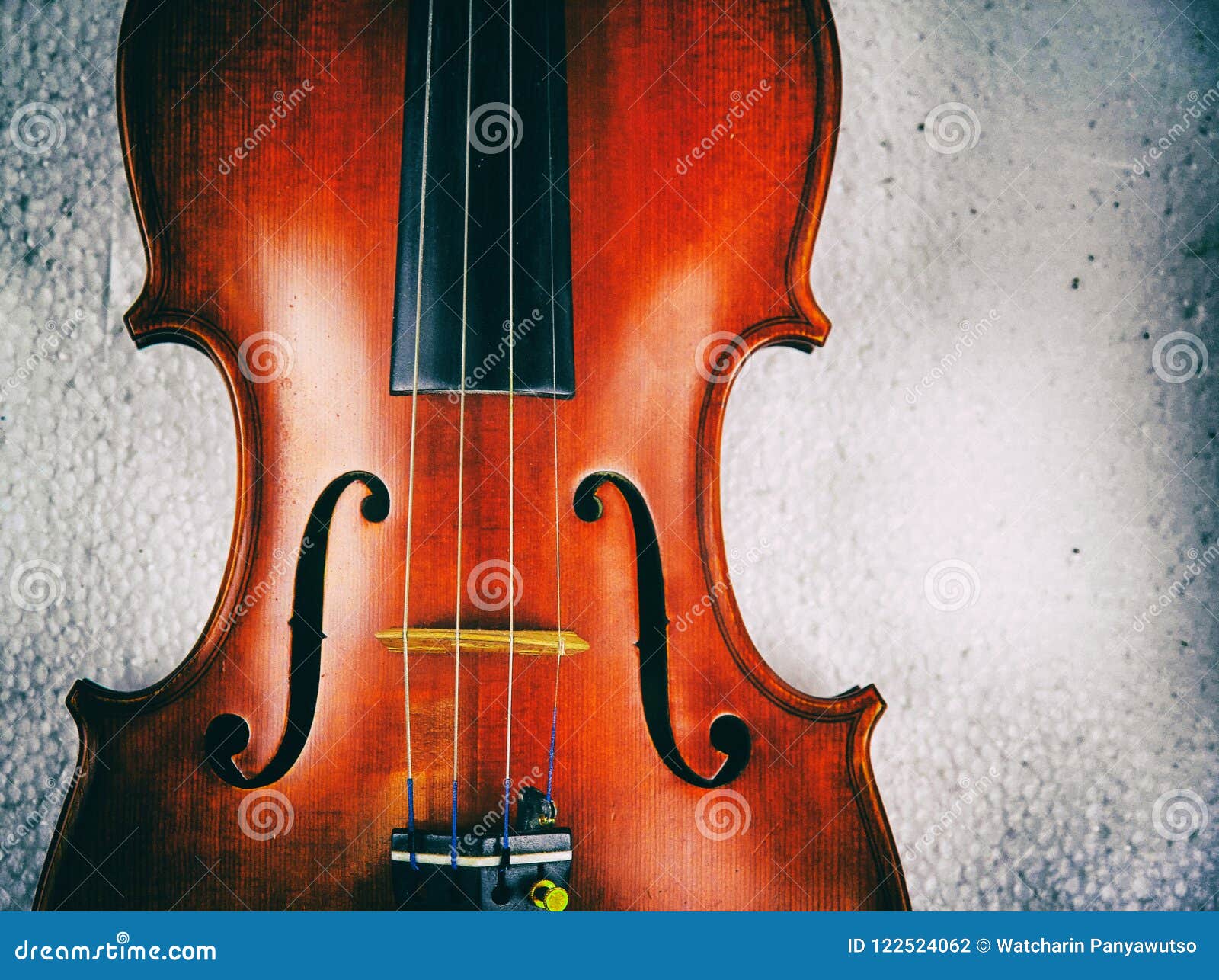 the abstract art  background of wooden violin,show front side and string,f - holes,in dramatic tone,vintage and art style