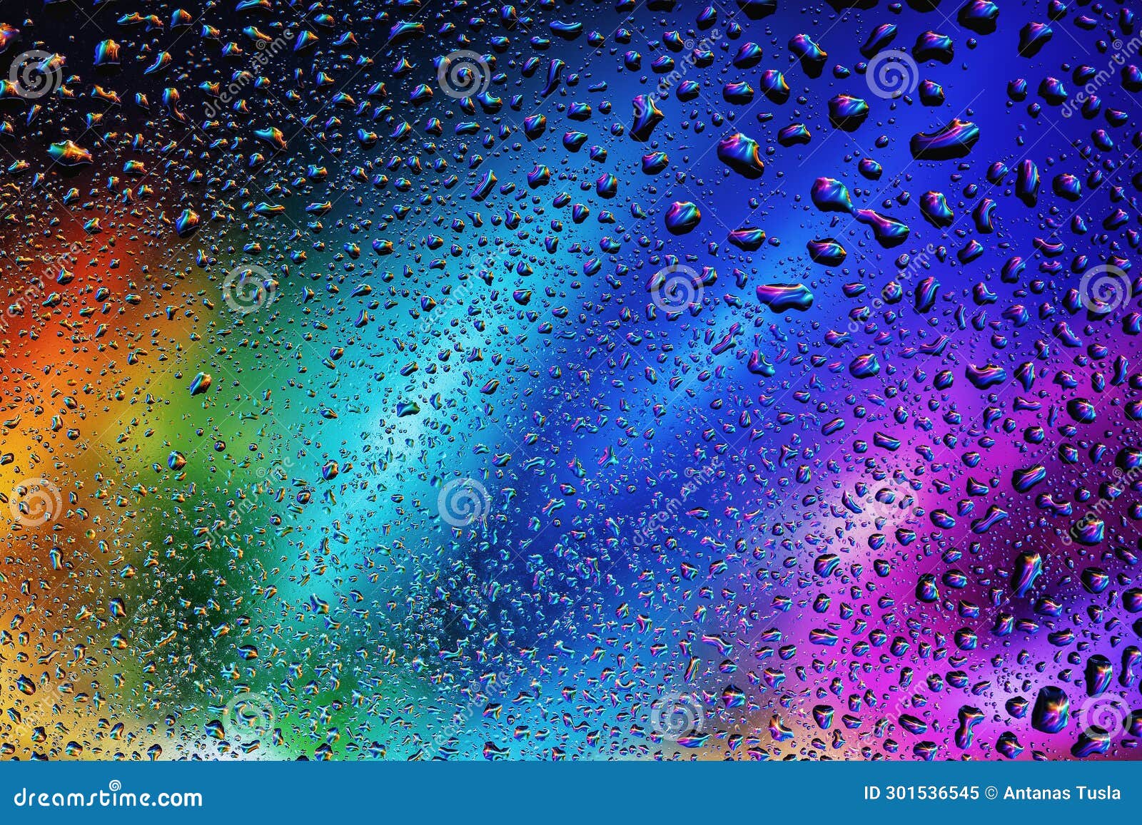 Abstract Background with Blurred Purple and Blue Raindrops on Glass
