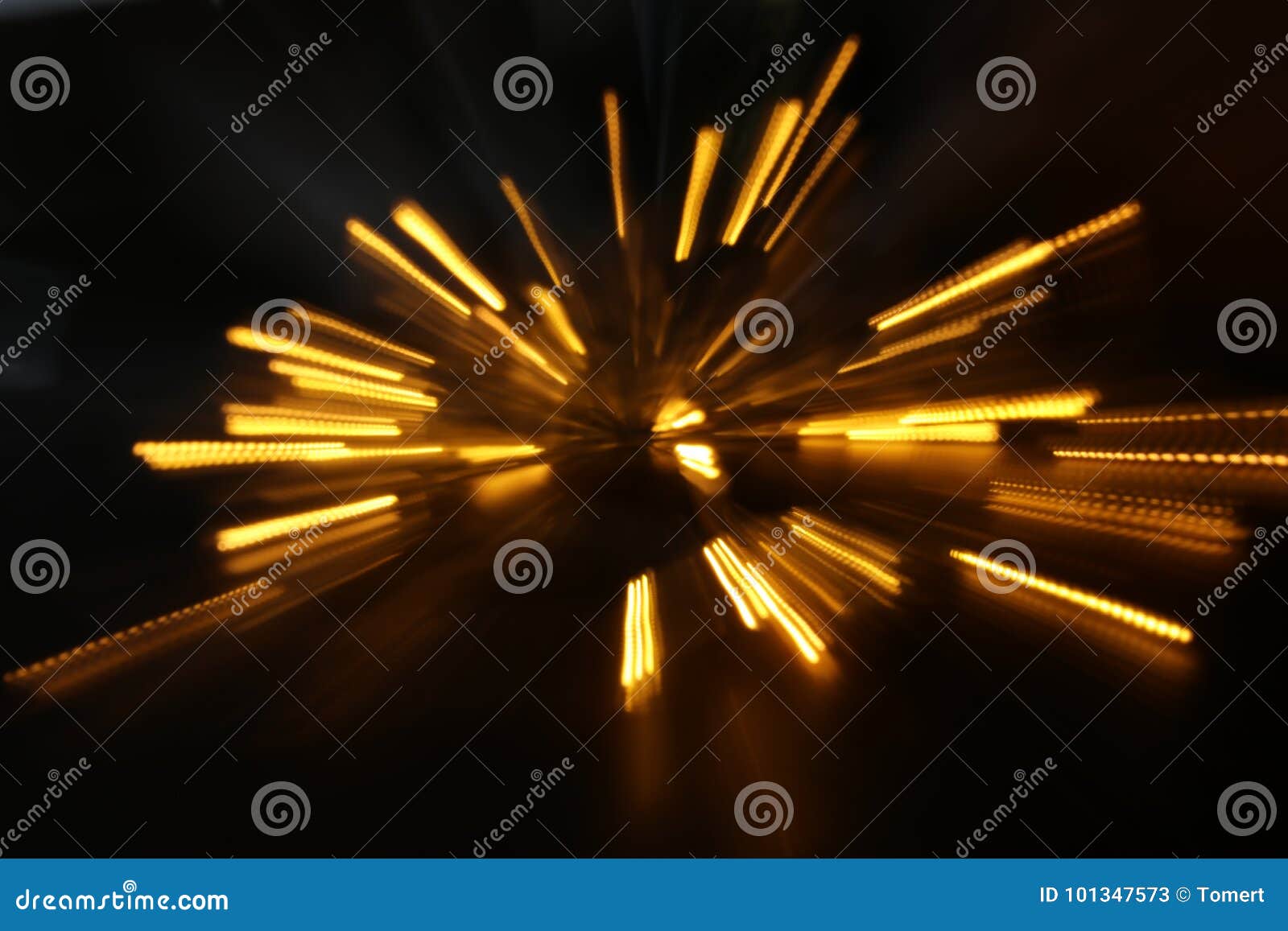 Abstract Background of Golden Light Burst Made from Bokeh Motion Stock
