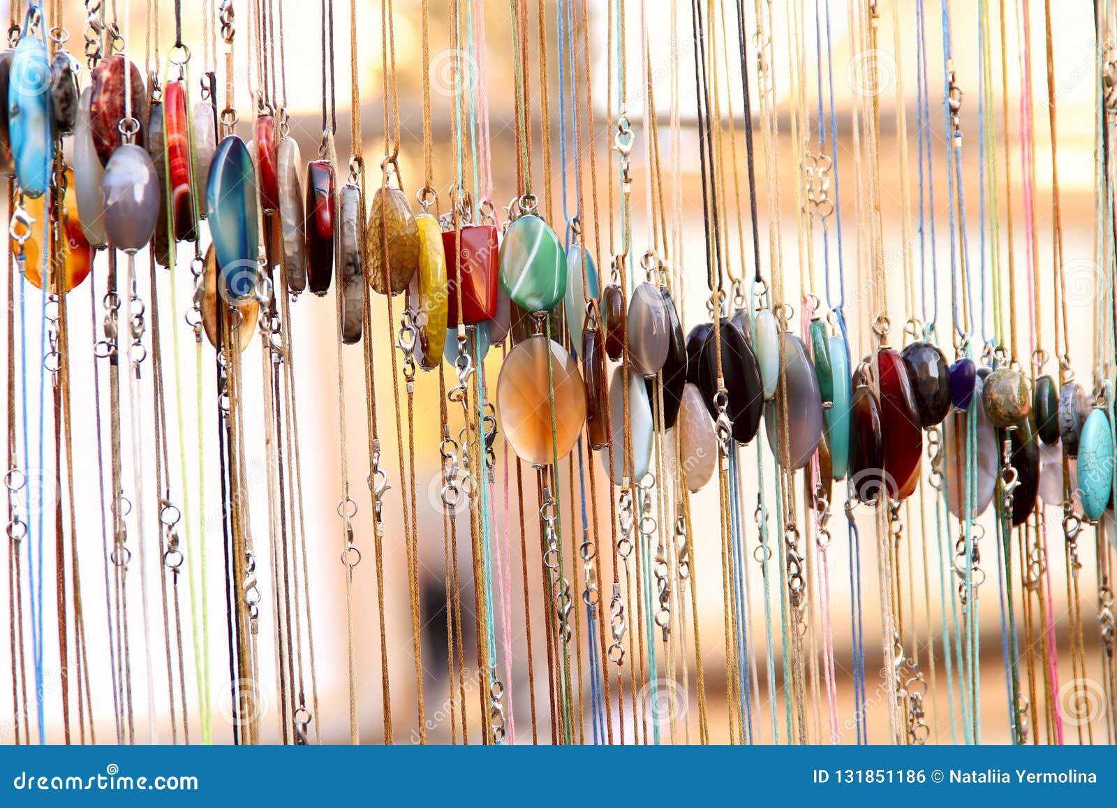 Abstract Background. Samples of Colorful Women`s Jewelry on a Chain of ...