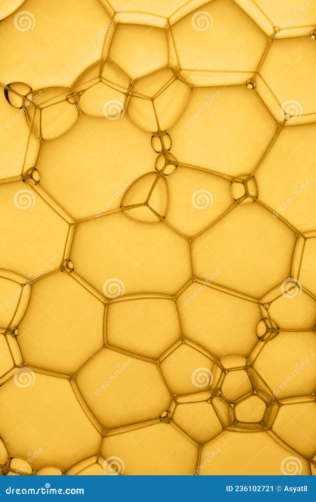 abstract background of soap bubbles on yellow background