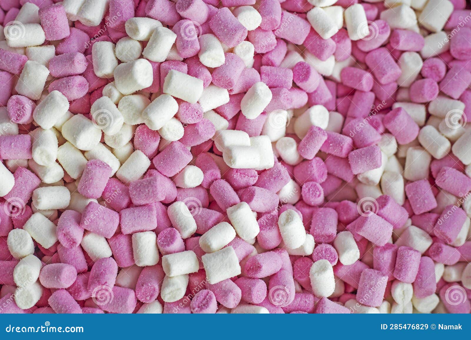 Abstract Background of Sweet Pink and White Pieces of Marmeshow. Stock