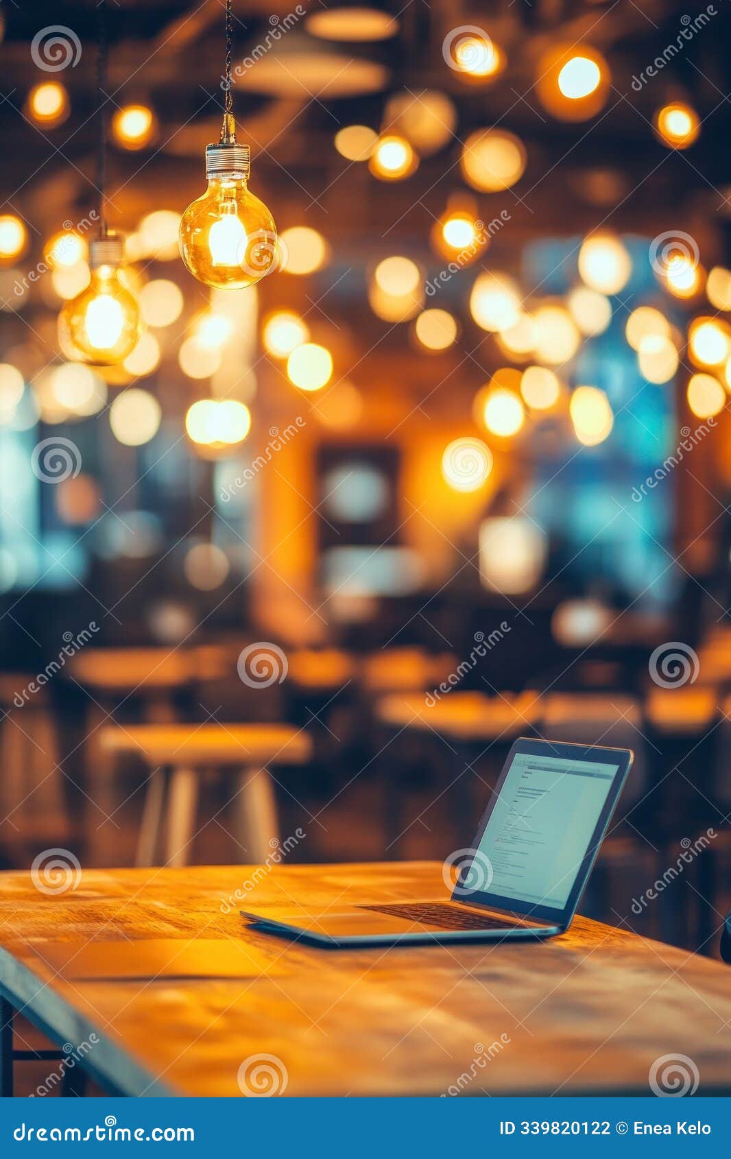 abstract blur coworking space with desks and laptops