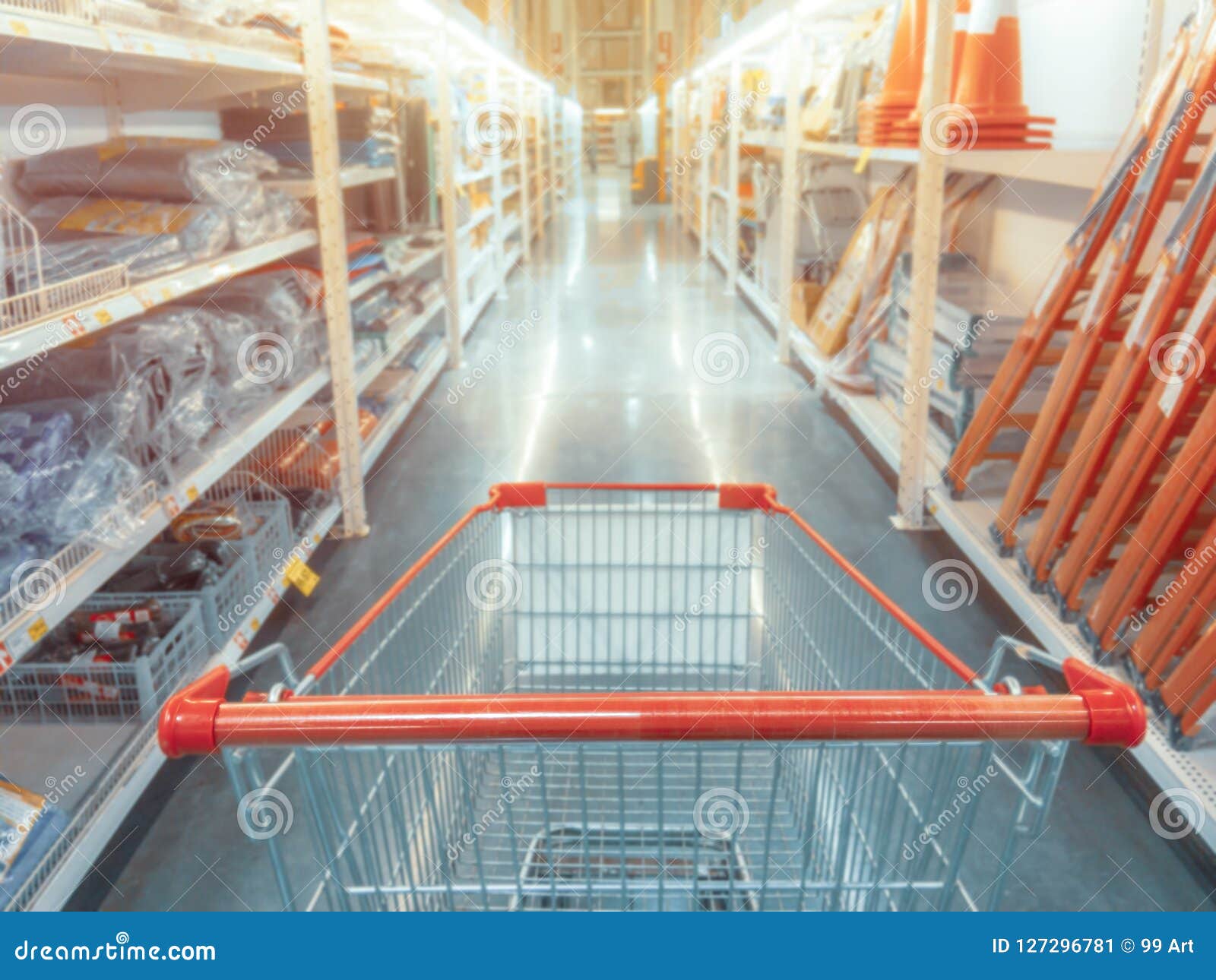 abstract blurred photo of hardware store with empty shopping car