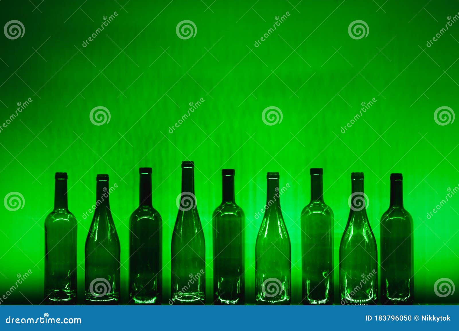 Abstract Empty Wine Bottles with Green Illumination Stock Photo Image