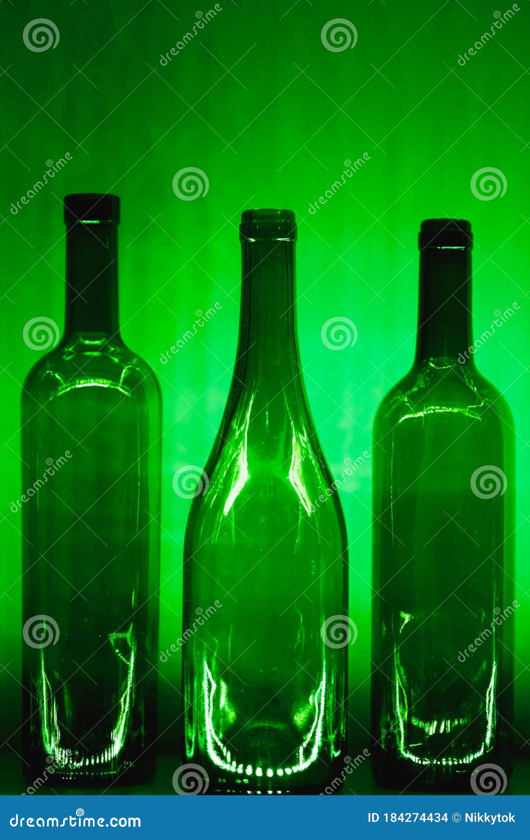 Abstract Empty Wine Bottles with Green Illumination Stock Photo Image