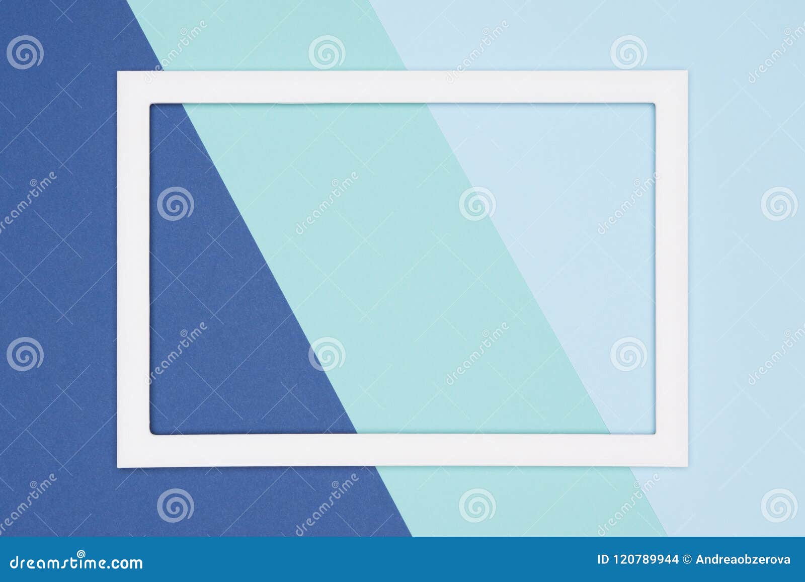 abstract geometrical flat lay pastel blue and turquoise colored paper background. minimalism template with empty picture frame.