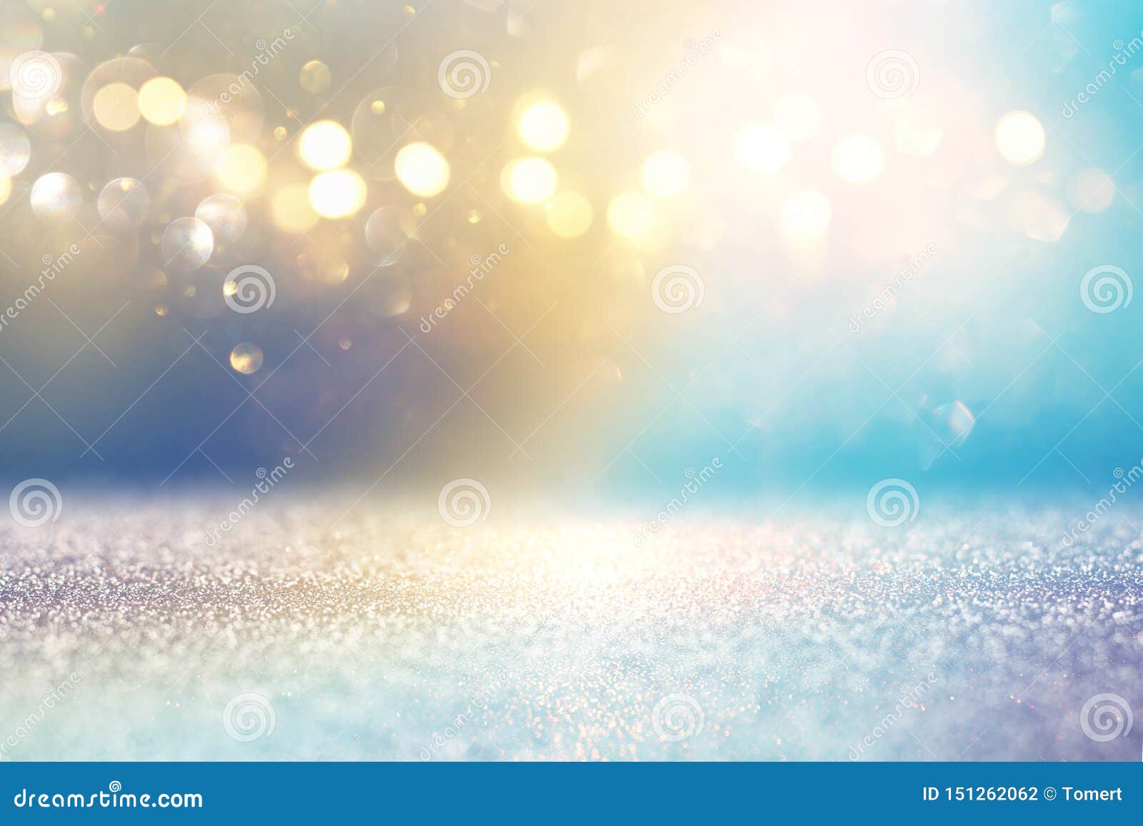 Abstract Glitter Lights Background. Golden and Light Blue Stock Photo