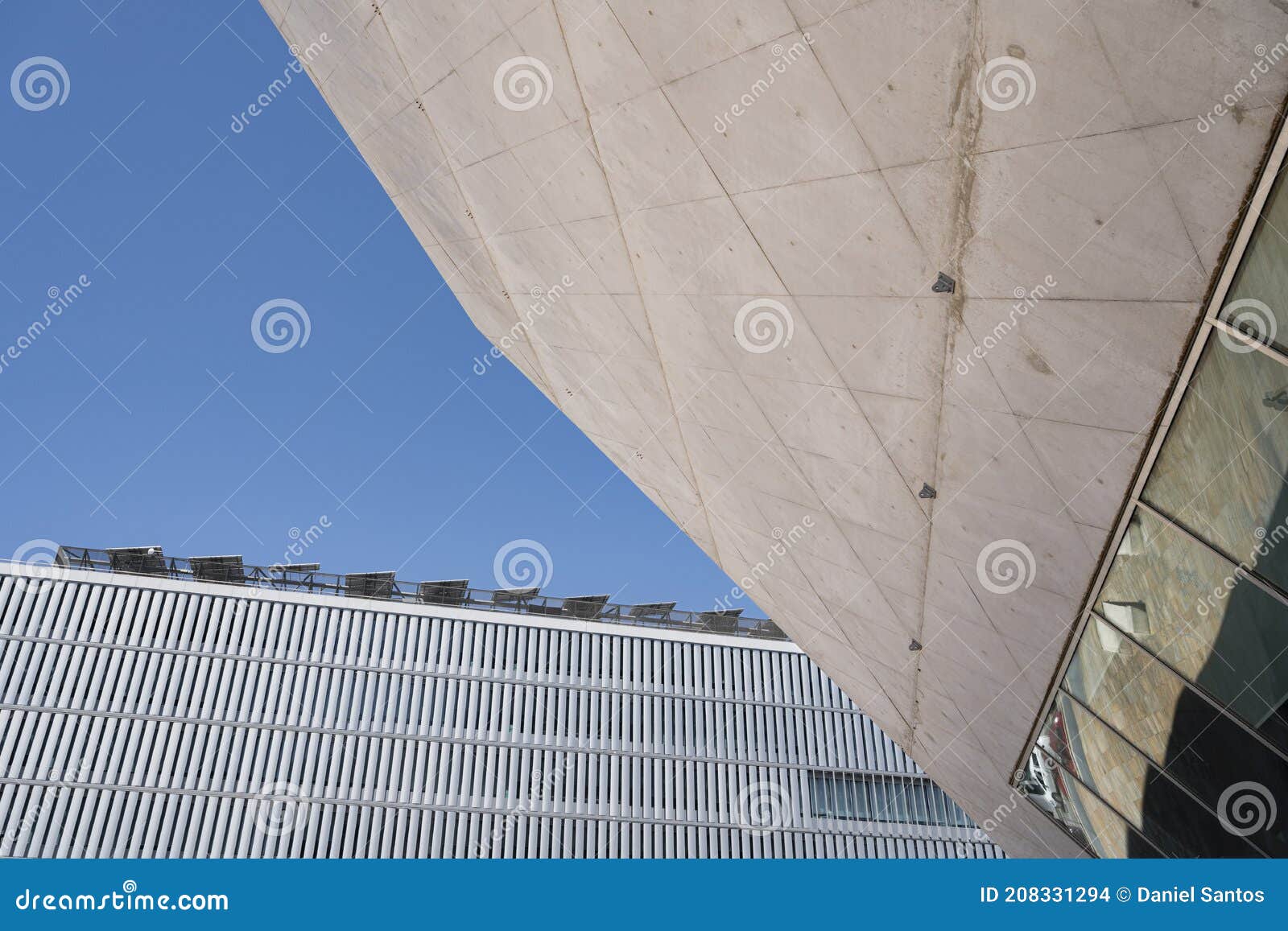abstract image of two modern buildings - modern architecture. close up shot of the casa da musica do porto porto music house.