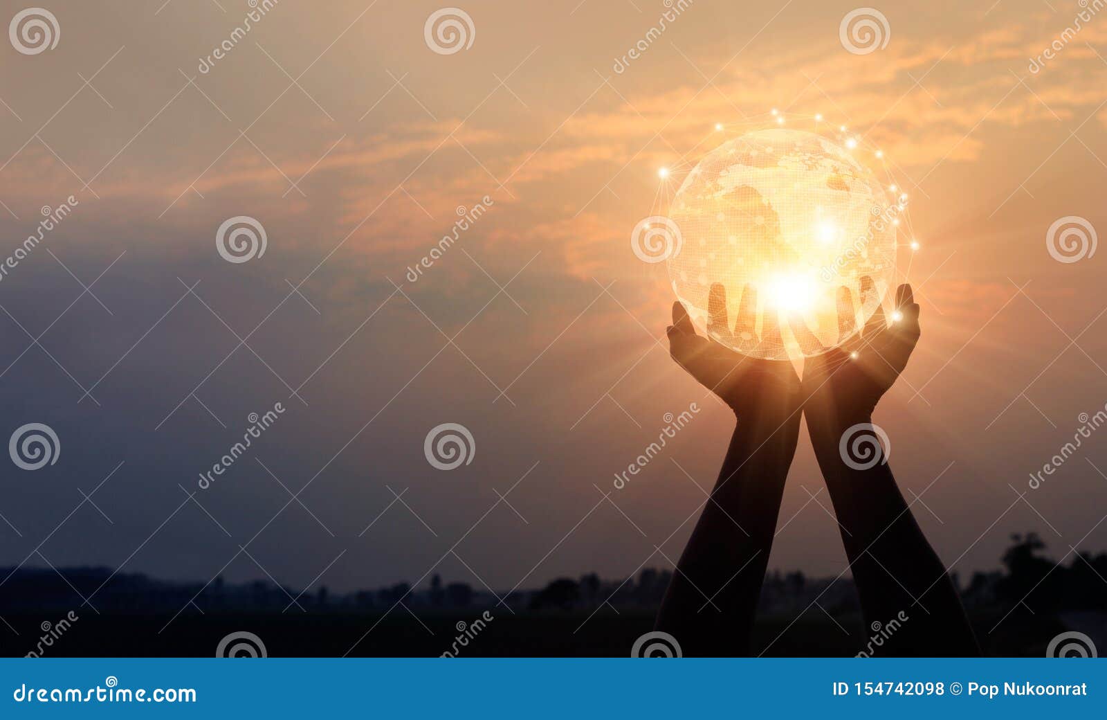 abstract networking. technology and communication. hands holding global network and data exchanges on sunset background
