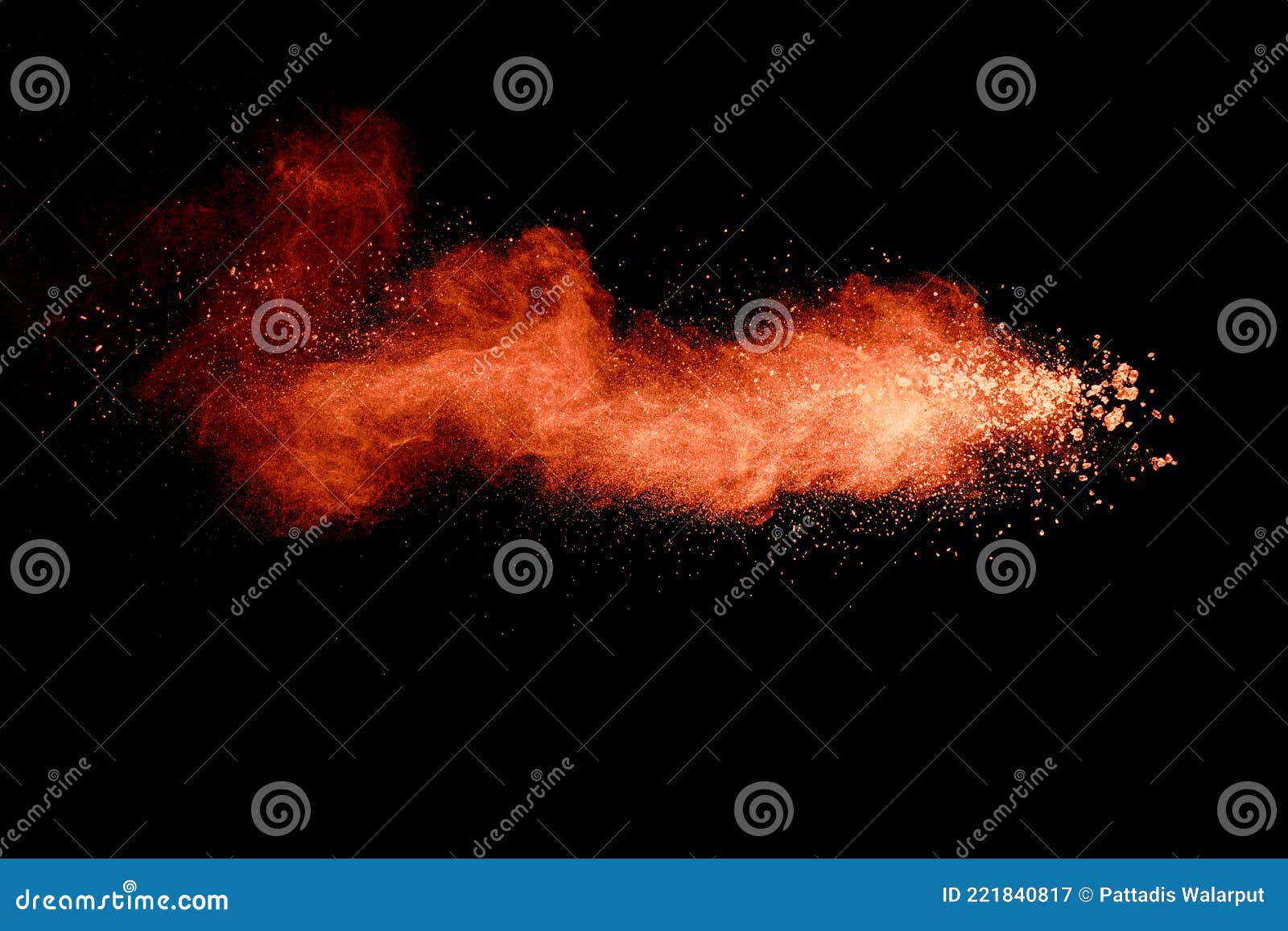 Abstract Orange Powder Explosion on Black Background. Freeze Motion of