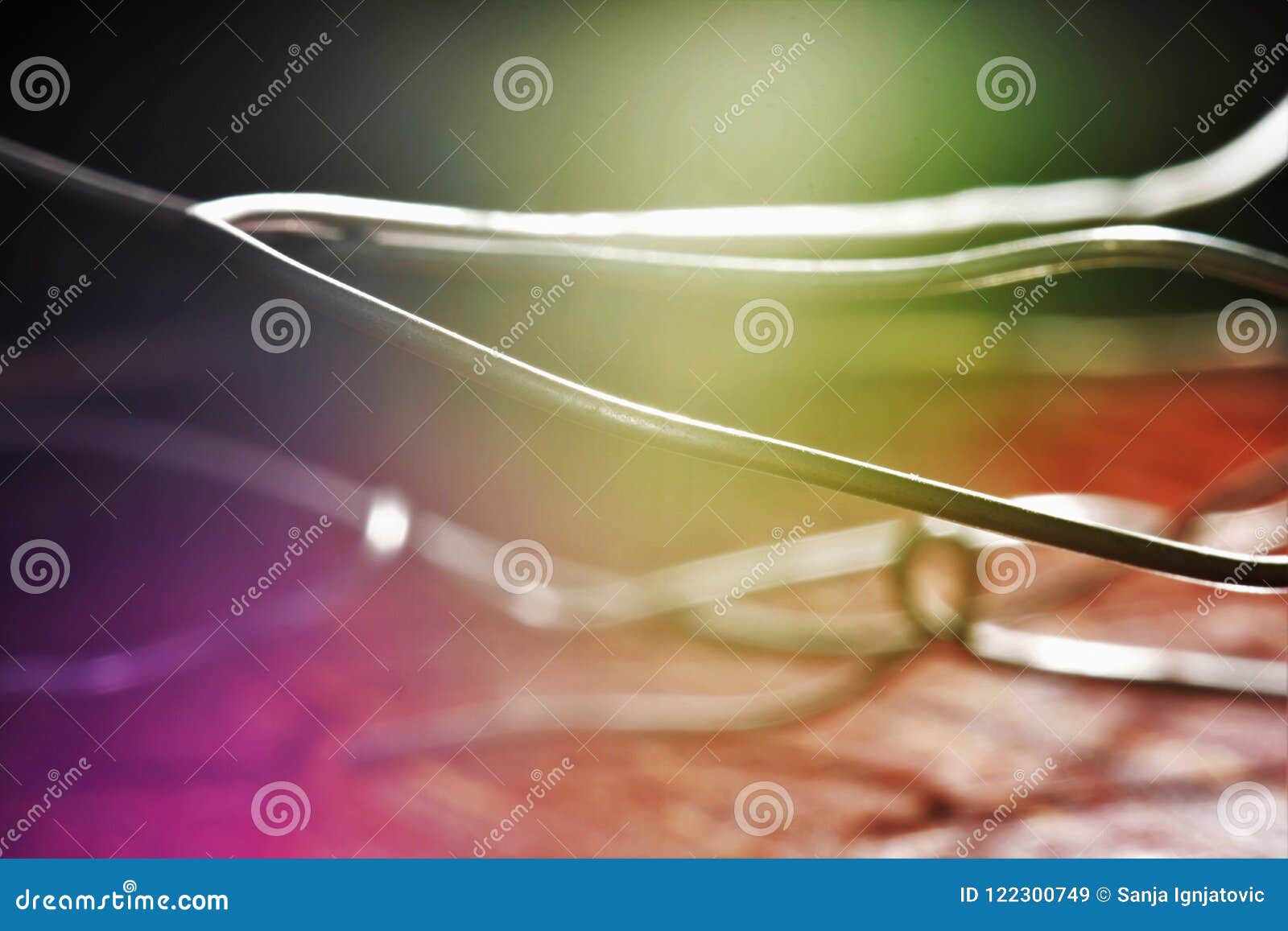 Wires, light and colors. An abstract photo of wires with a ray of light and colorful background.