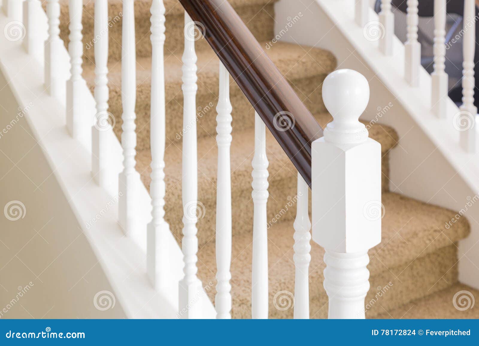 abstract of stair railing and carpeted steps in house