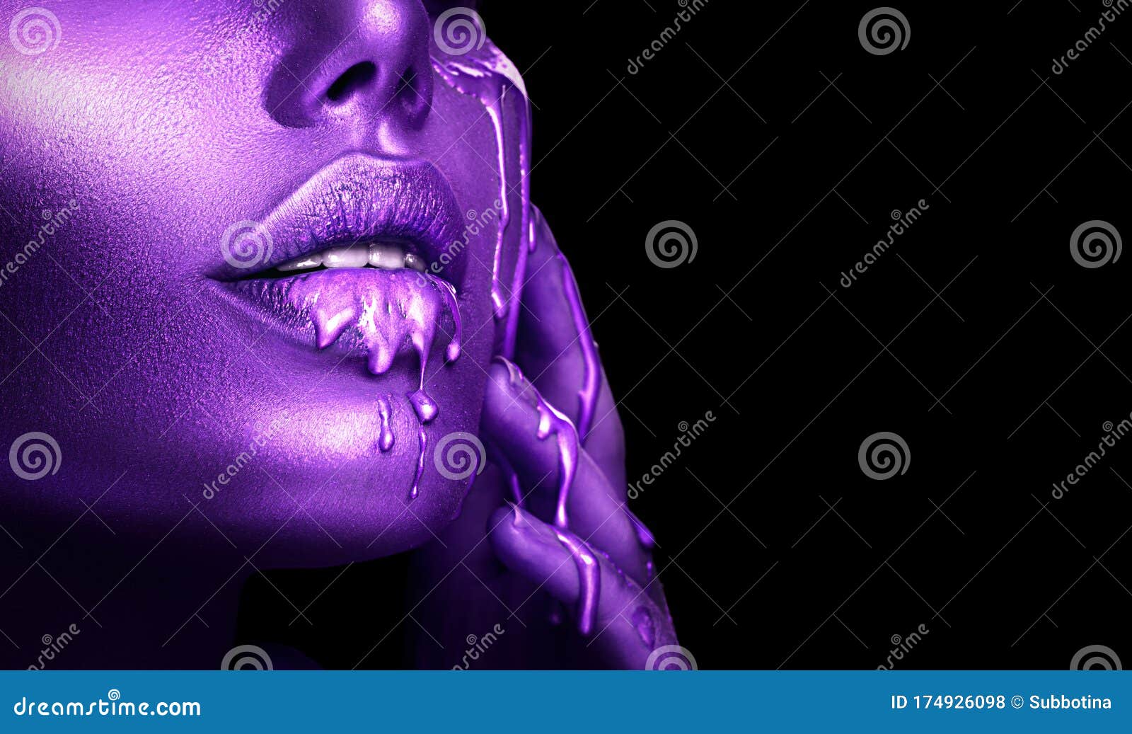abstract violet makeup, lipstick dripping. purple paint drops on sexy lips. lipgloss drops, liquid drops on beautiful face