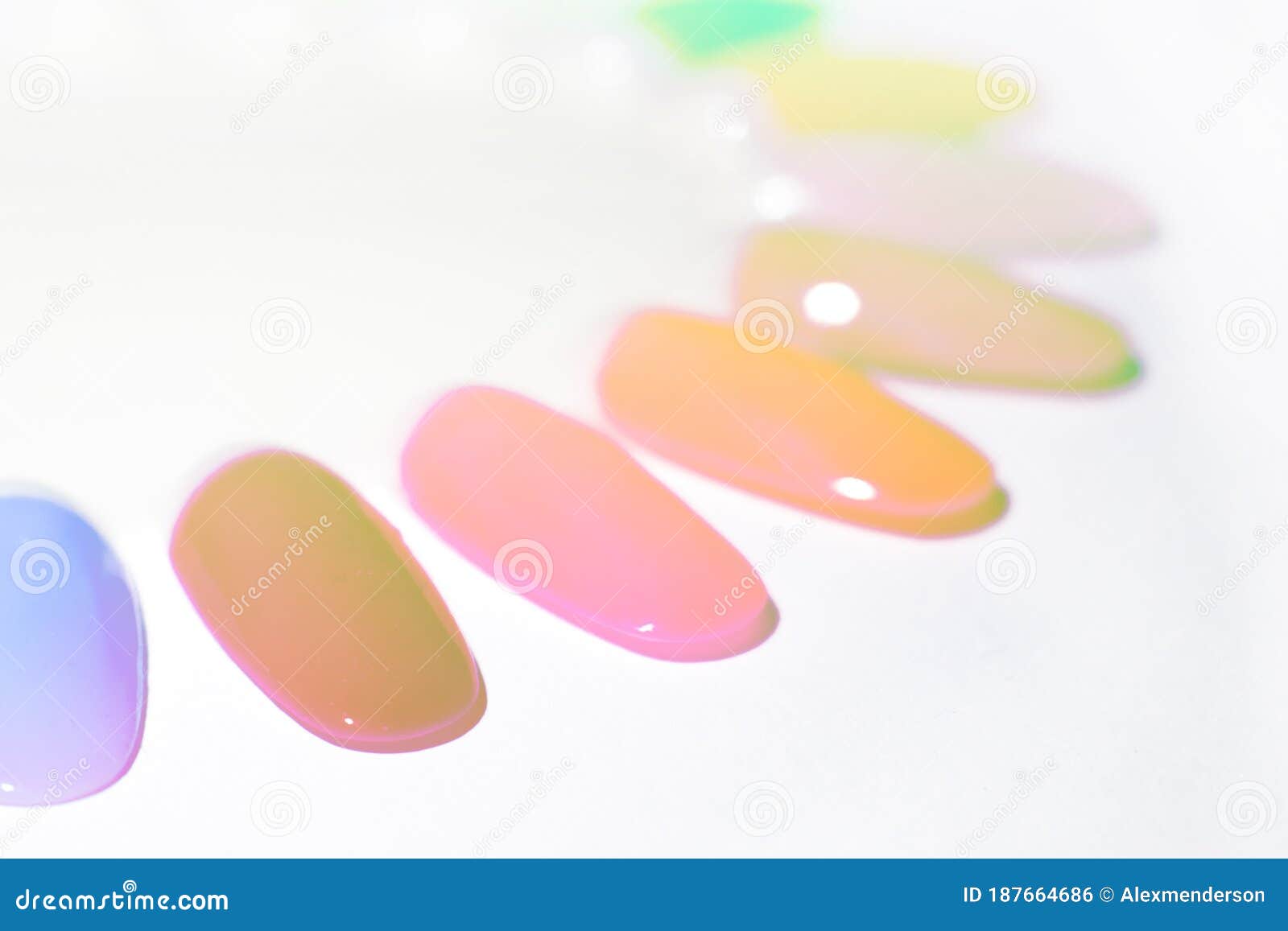Colorful Nail Polish Tester Isolated on a Light Background. Stock Photo