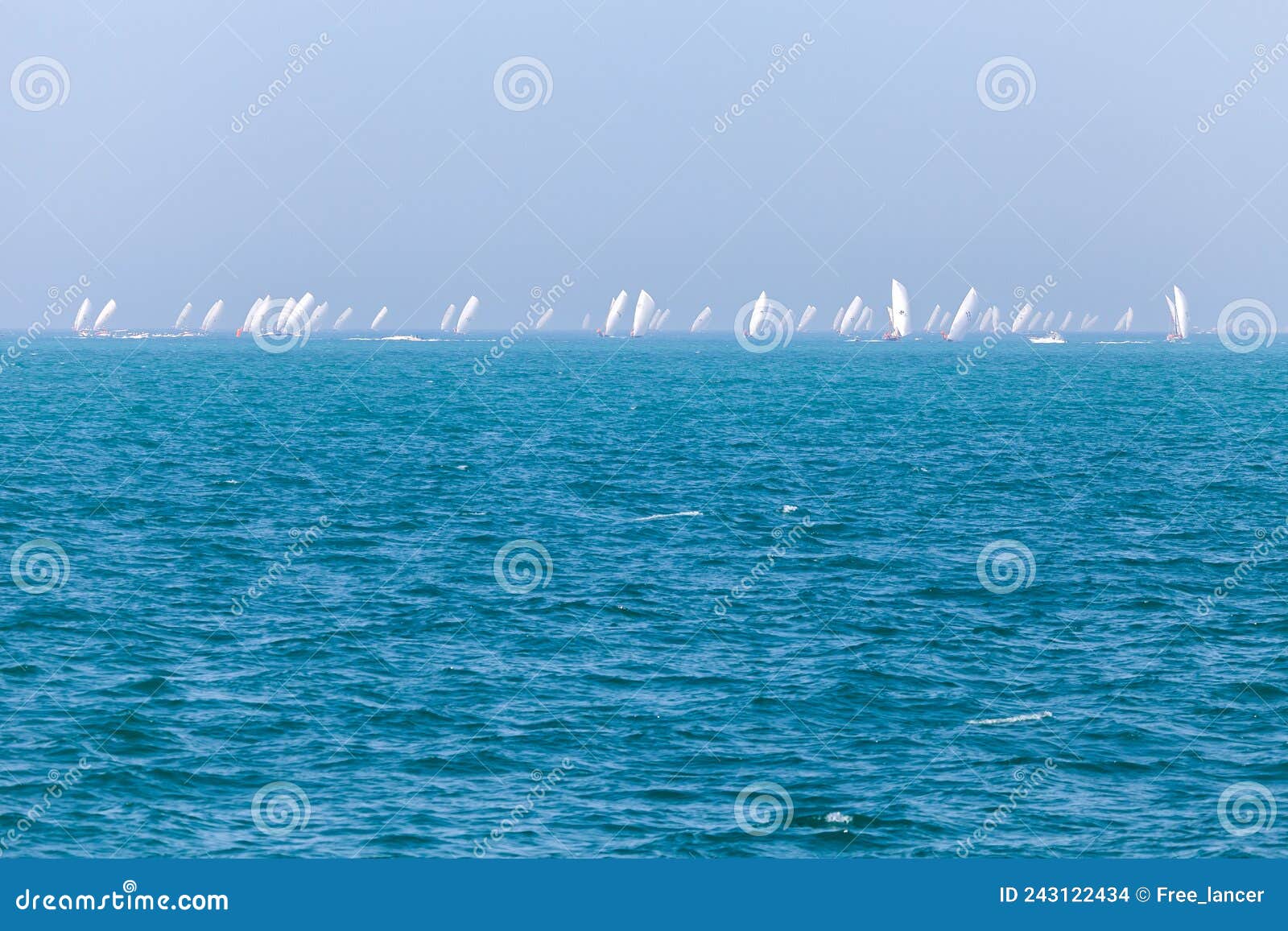 abu dhabi, uae - march 17, 2013: traditional 60 feet dhow sailing race in abu dhabi, uae
