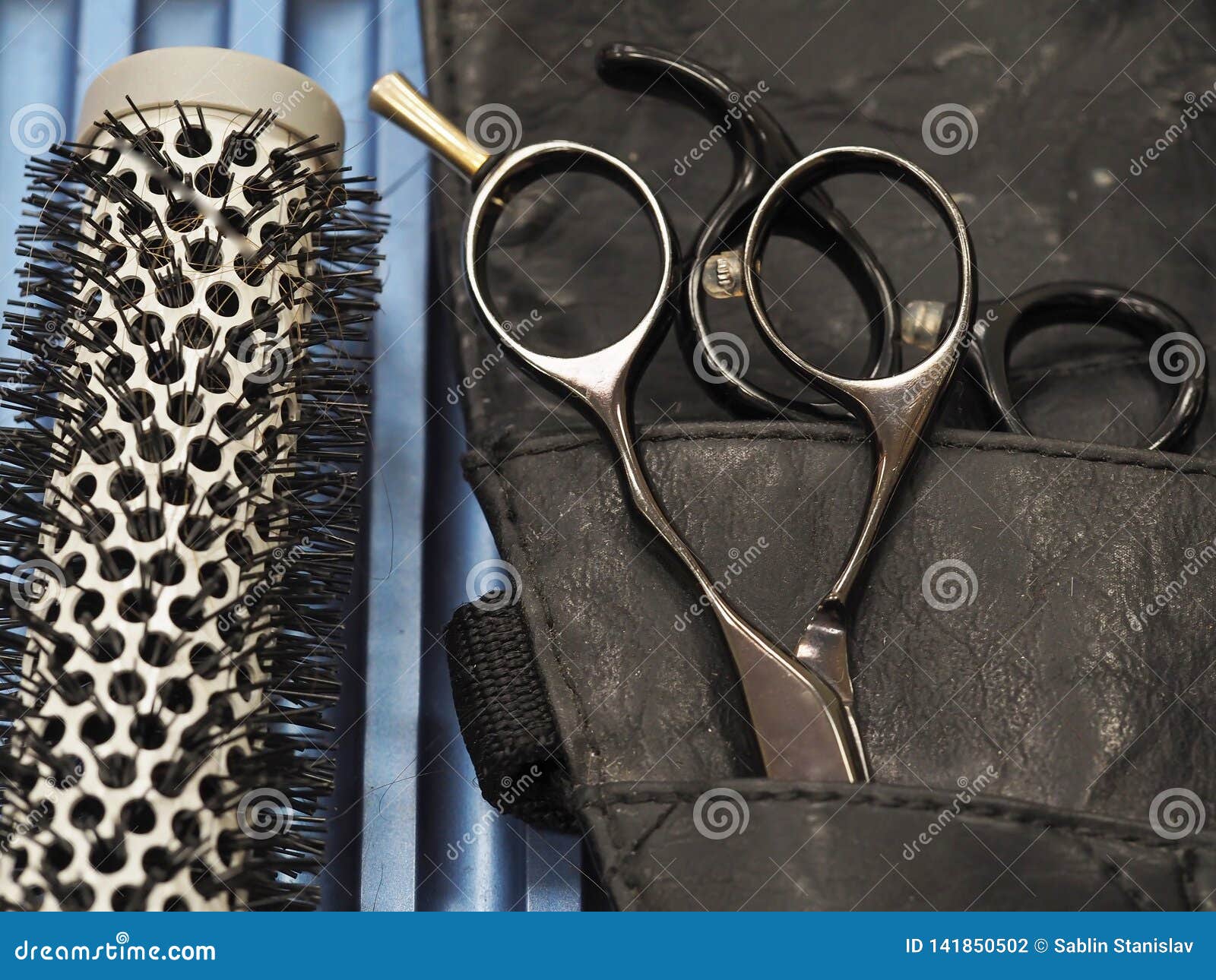 Accessories for Haircuts. Scissors and Comb for Hair Stock Photo