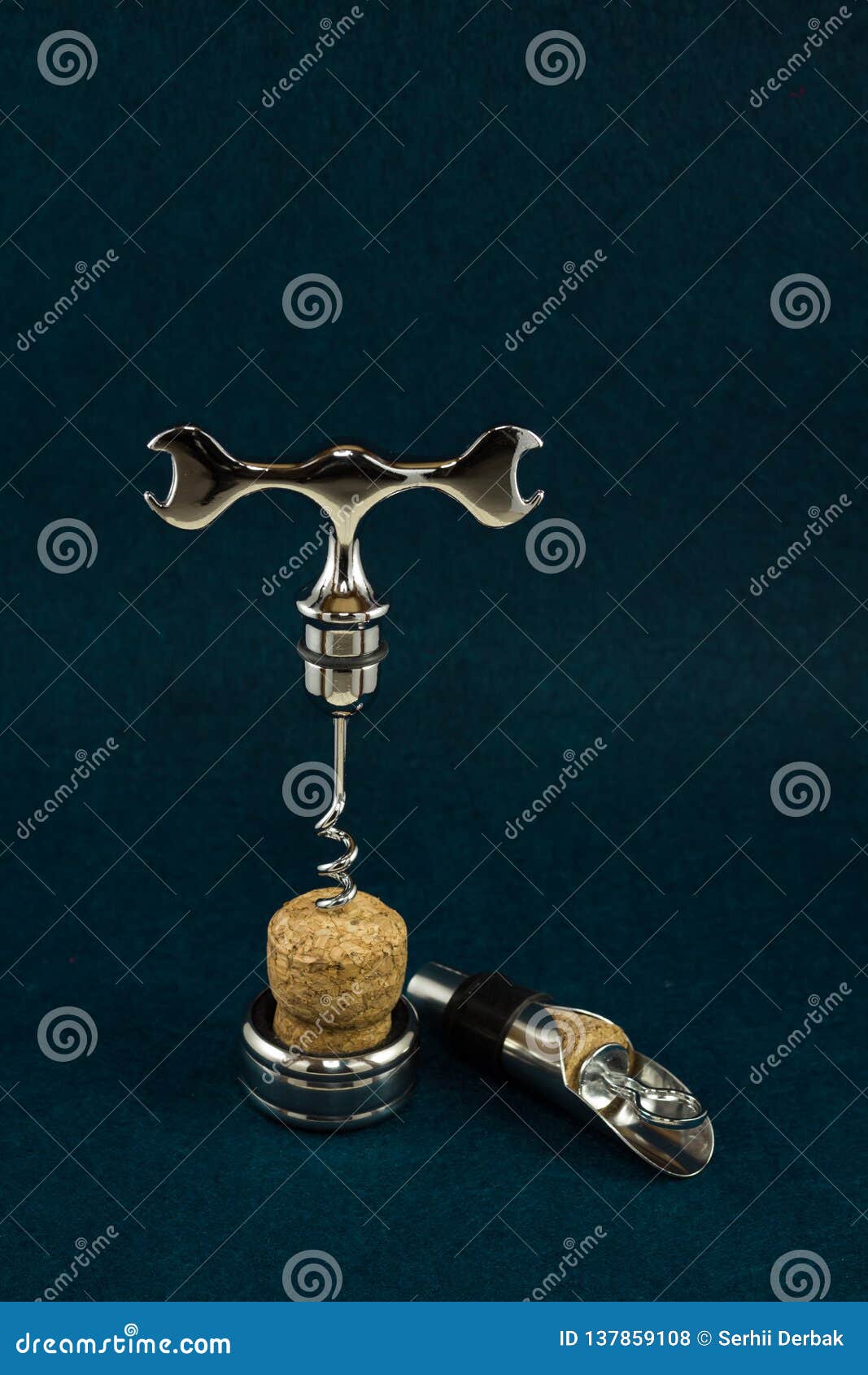 Accessories for Opening a Bottle of Wine Corkscrew Funnel on a Dark Turquoise Background Stock