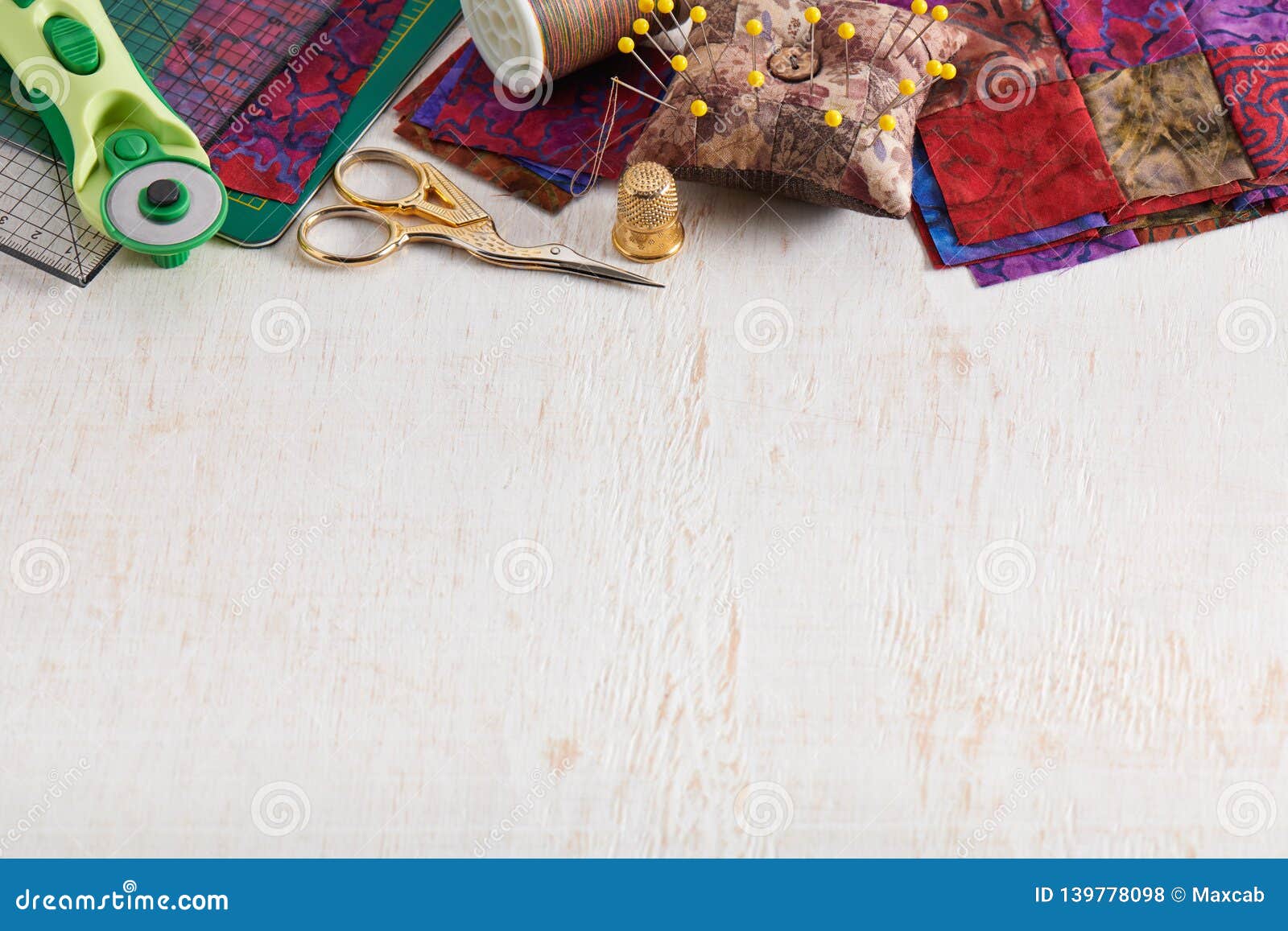 Accessories for Quilting on White Wooden Surface on the Upper Part of