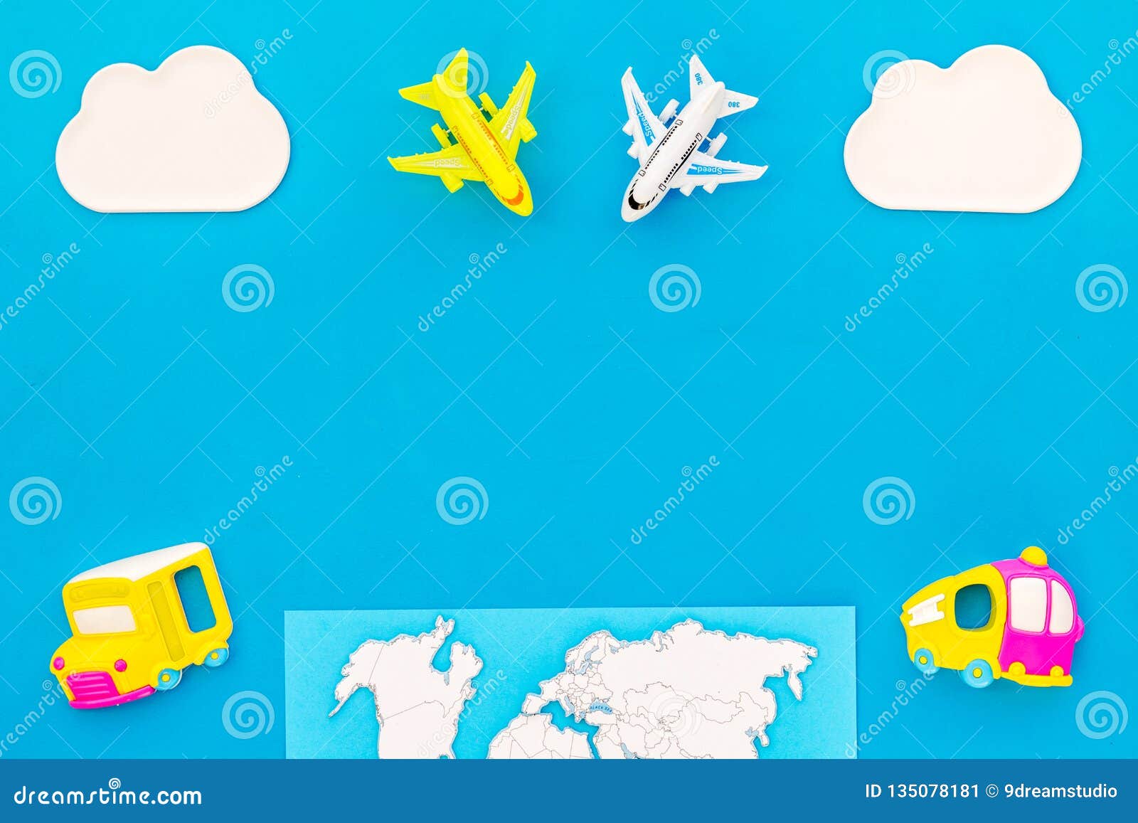 accessories for treveling with children, map and toys on blue background top view mock-up