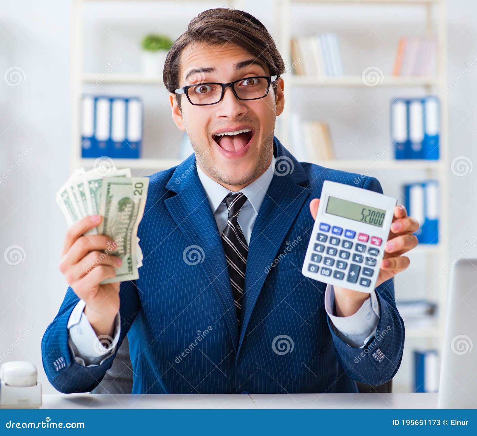 Accountant Calculating Dollars with Calculator in Office Stock Image